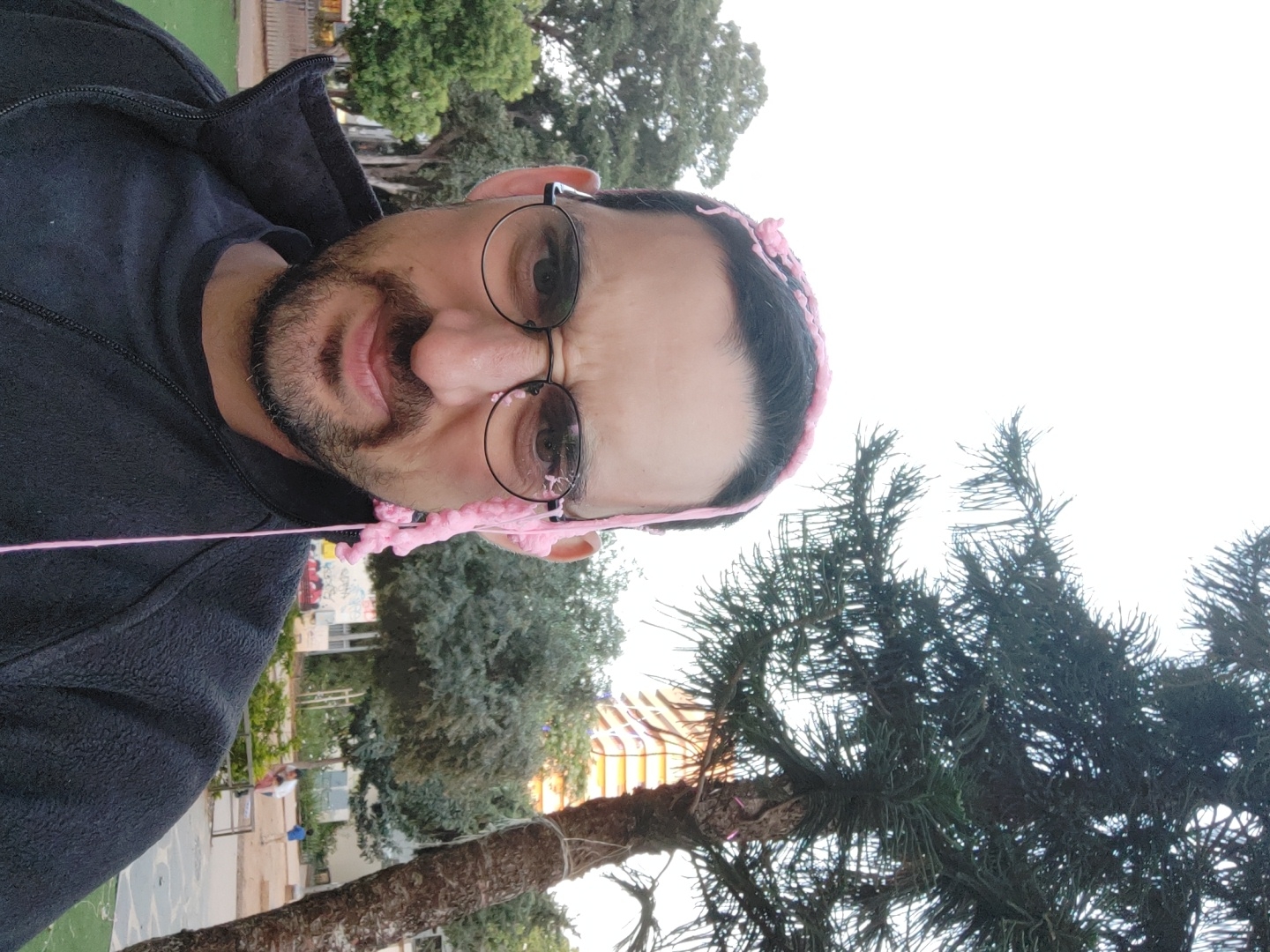 Man plays with pink slime outdoors in Tel Aviv