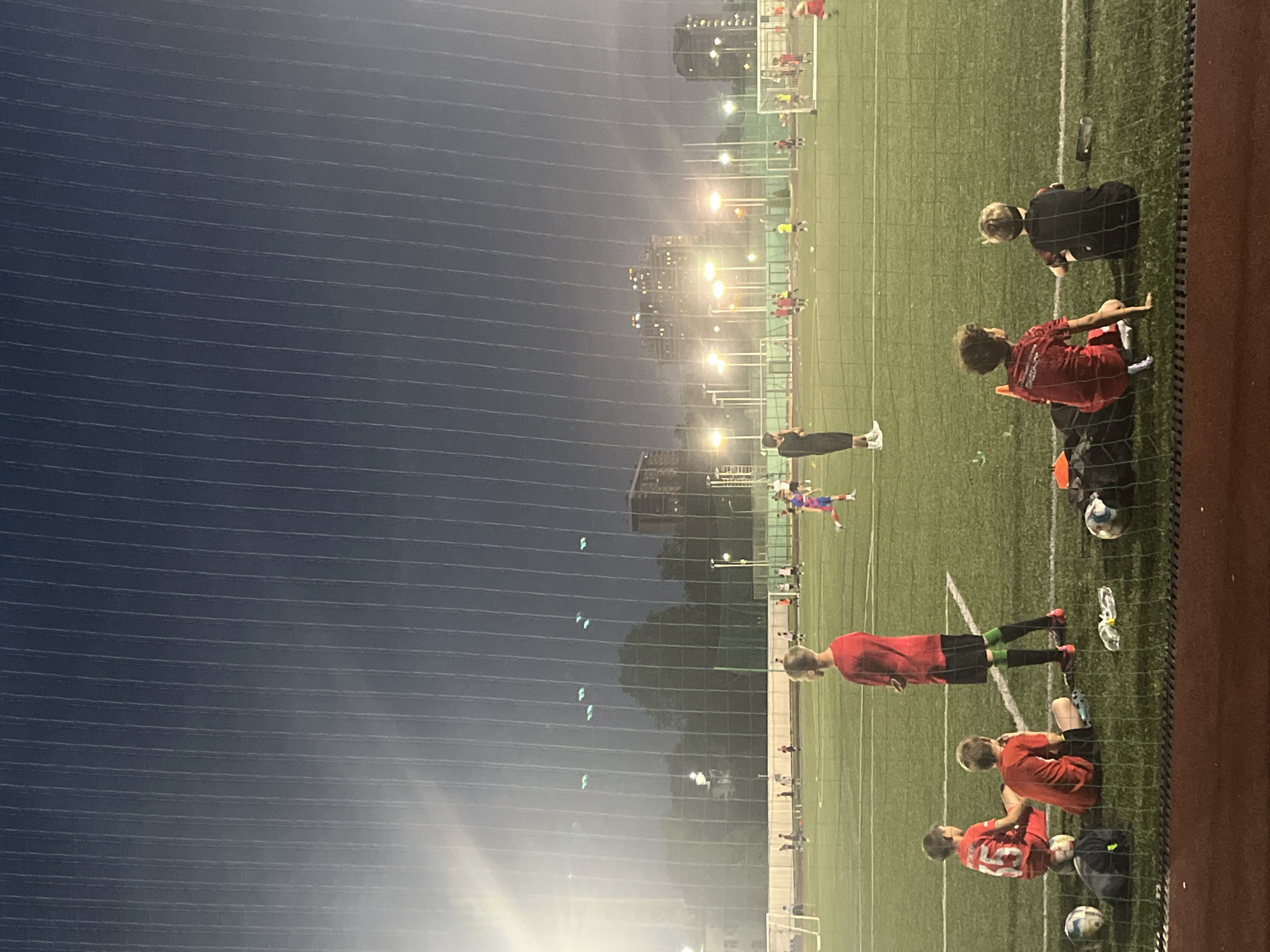 Twilight along the Kuban River, Krasnodar, with soccer and street scenes
