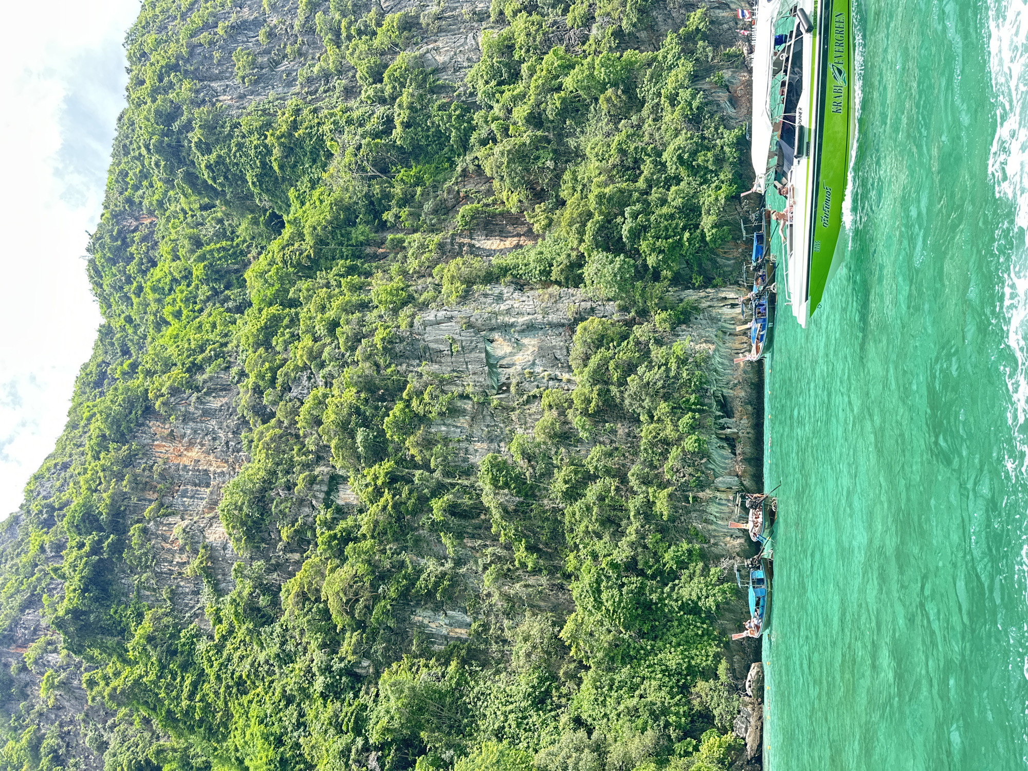 Longtails and speedboats in Maya Bay's turquoise waters