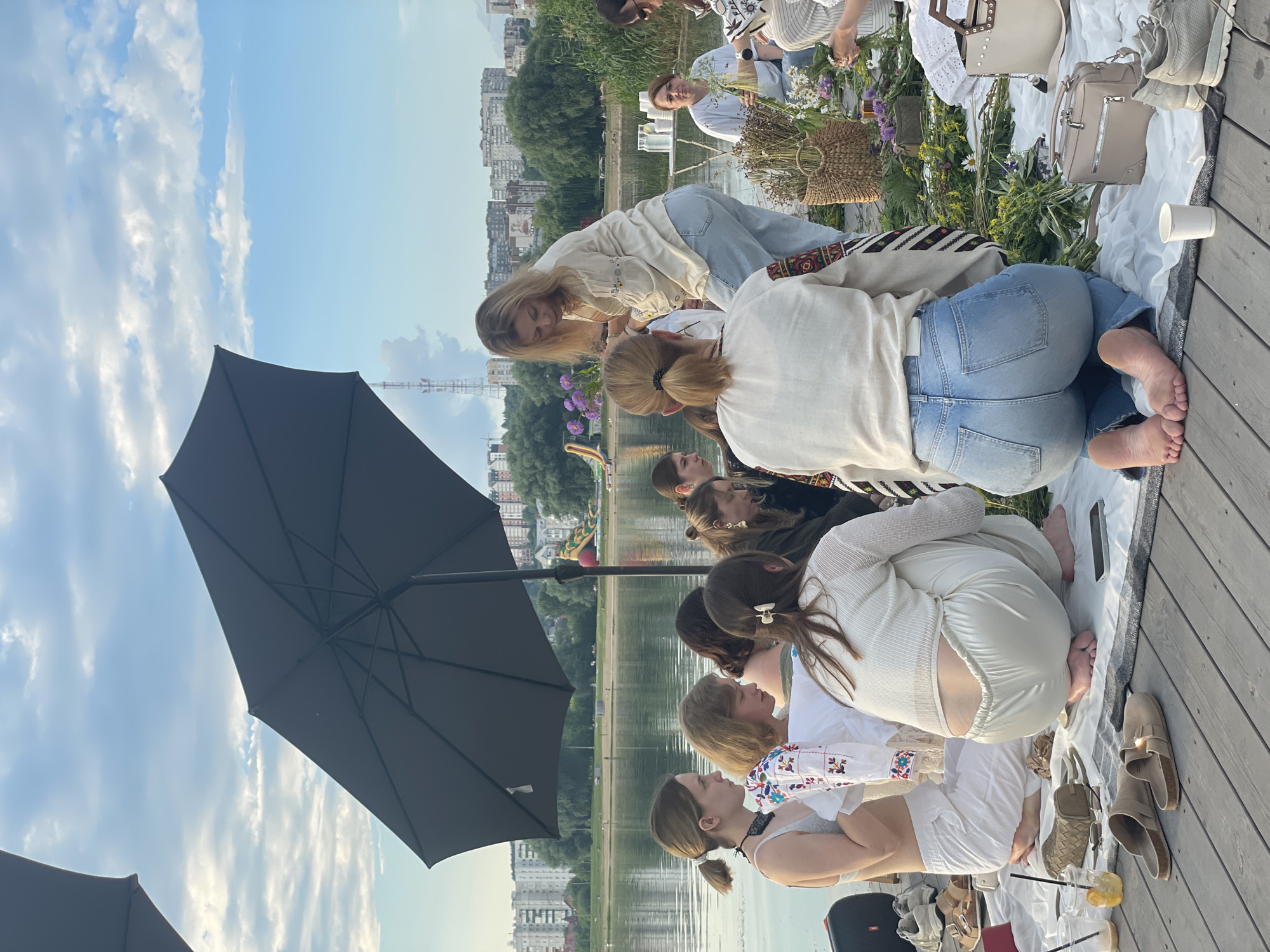 Riverside picnic on a wooden pier in Khmelnytskyi, Ukraine