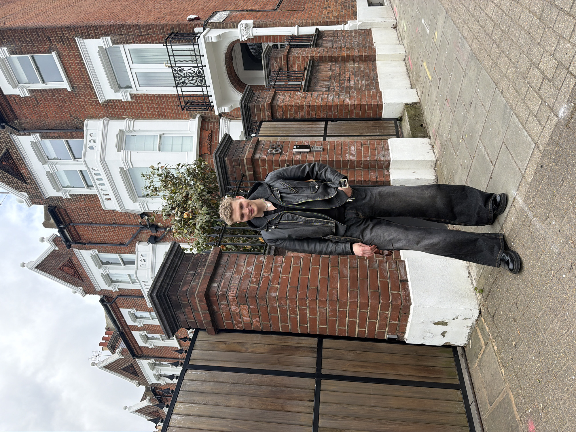 Man in leather jacket spotted outside London building