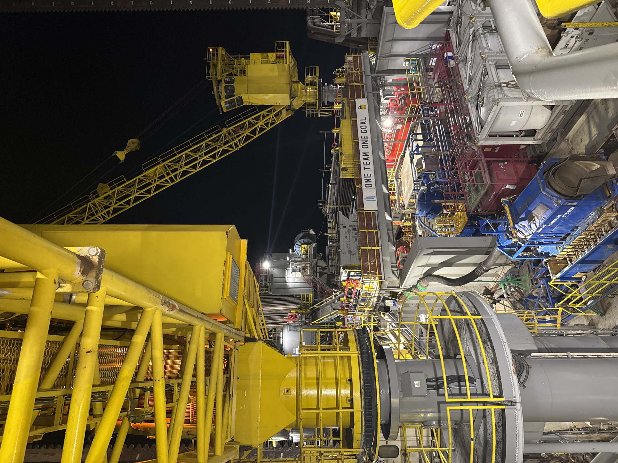 Offshore oil rig operations documented at night in Italy