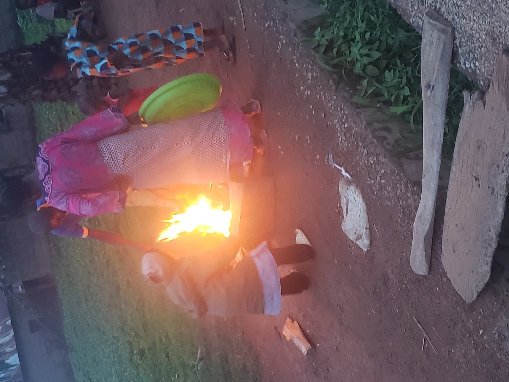 Community gathers around bonfire in Gumel, Nigeria