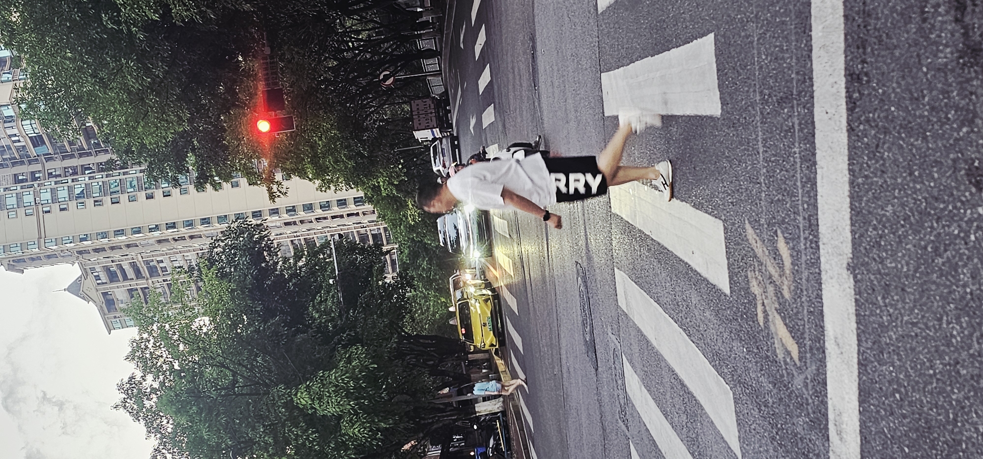 Pedestrians cross street at Chongqing intersection during red light