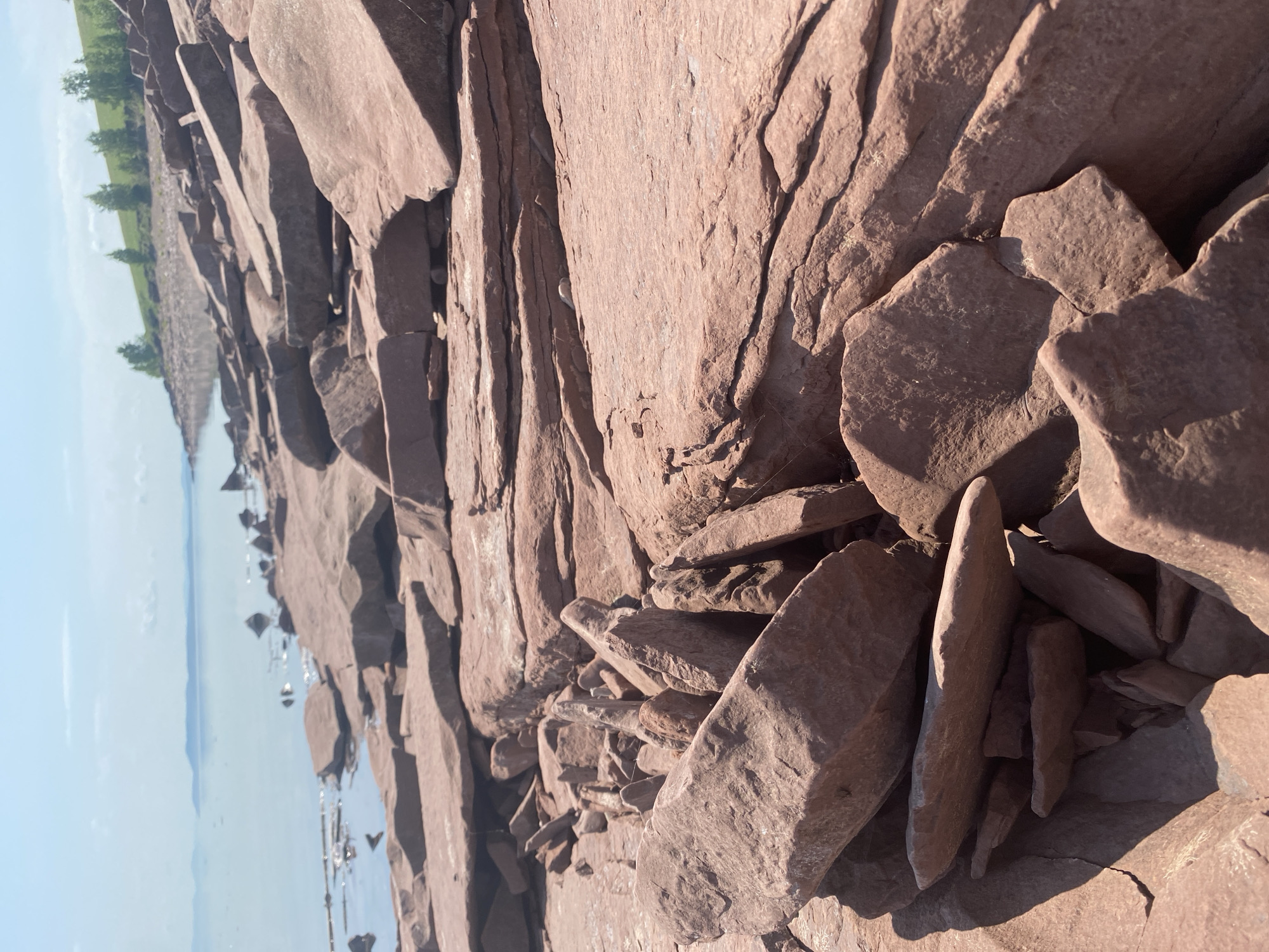 Early morning fishing documented along rocky Ust'-Erba shoreline