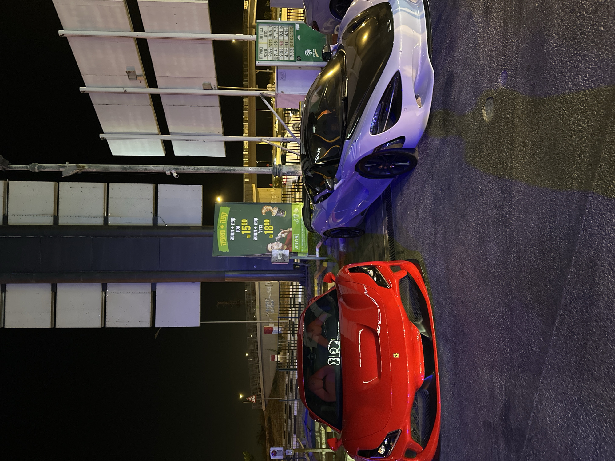 Late-night supercar meetup at an Israeli gas station