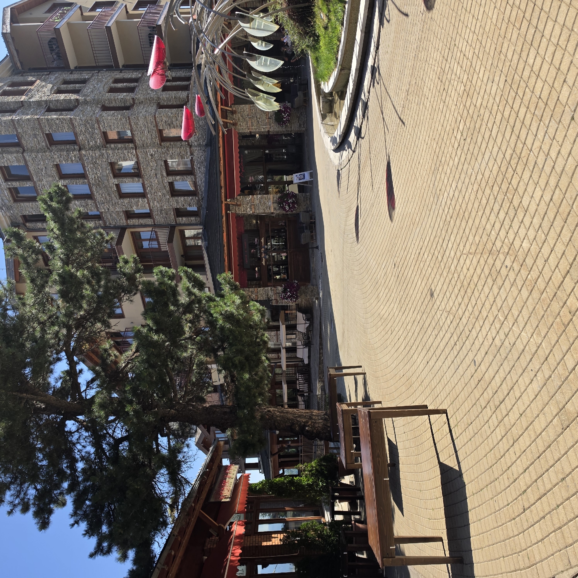 Sunny morning at Razlog resort area with fountain sculpture