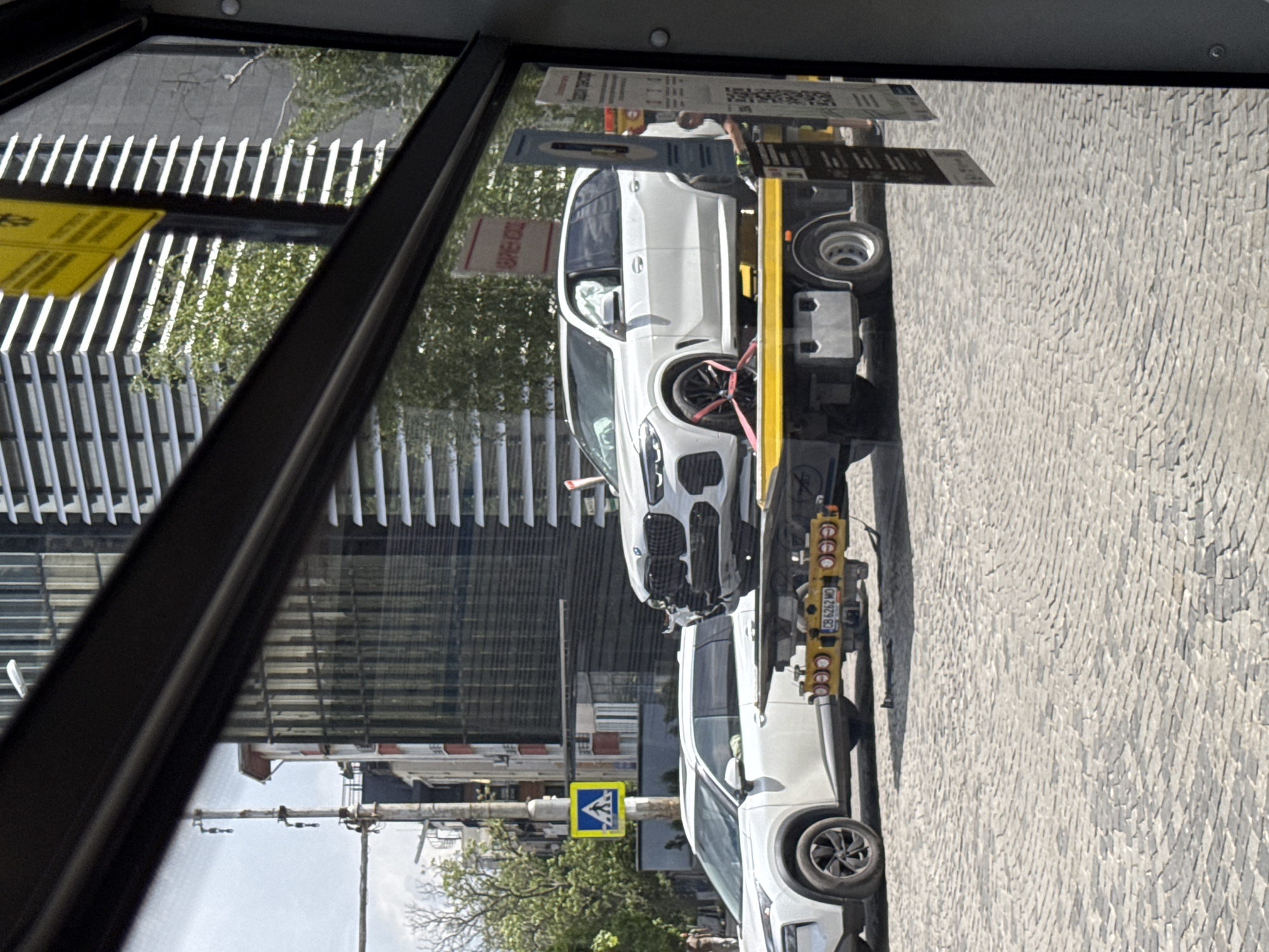 Damaged BMW towed from Sofia street after apparent accident