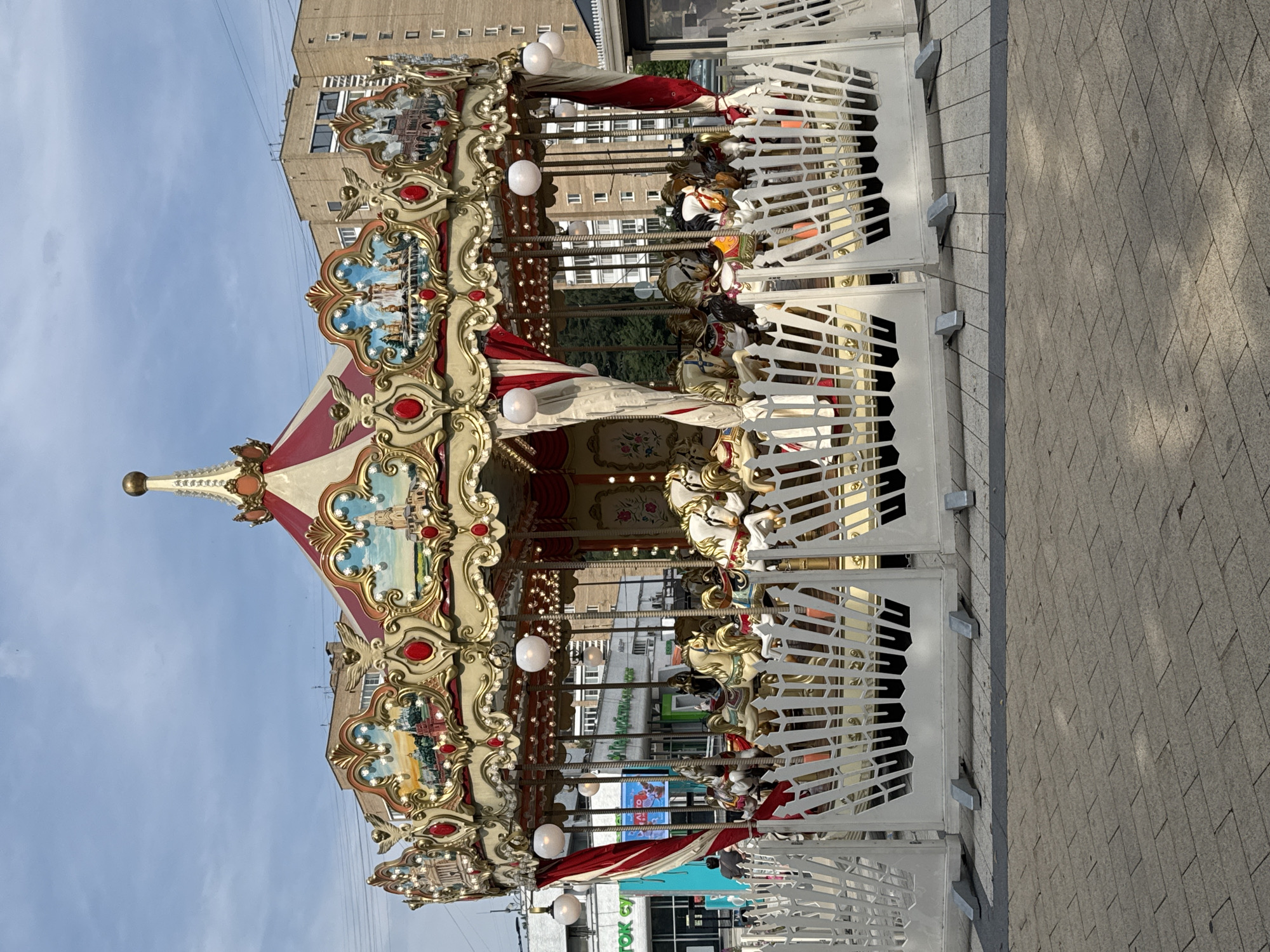 Elaborately decorated carousel running in a Zelenograd urban plaza