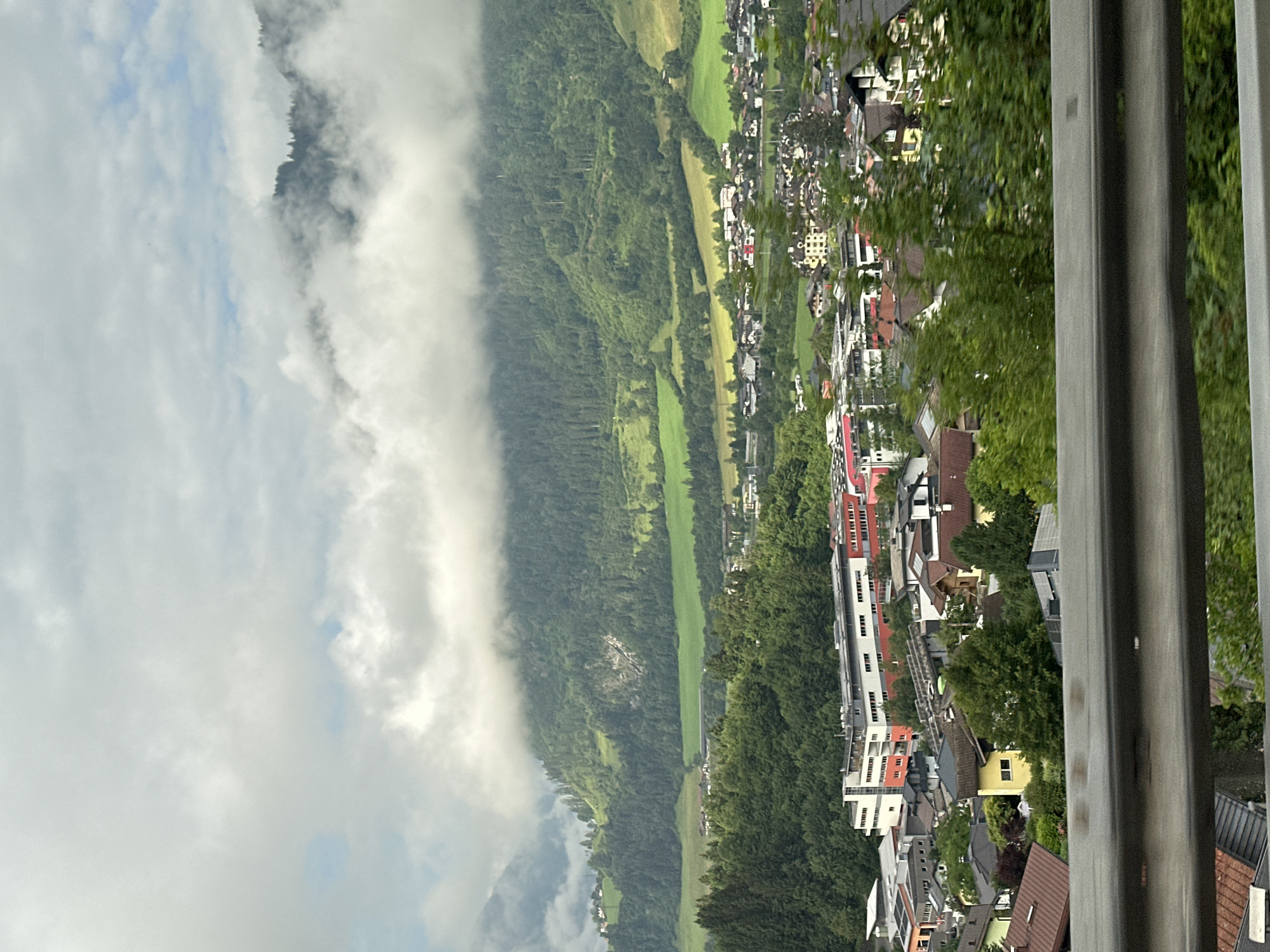 Overcast morning over forested mountain slopes in the Austrian Alps
