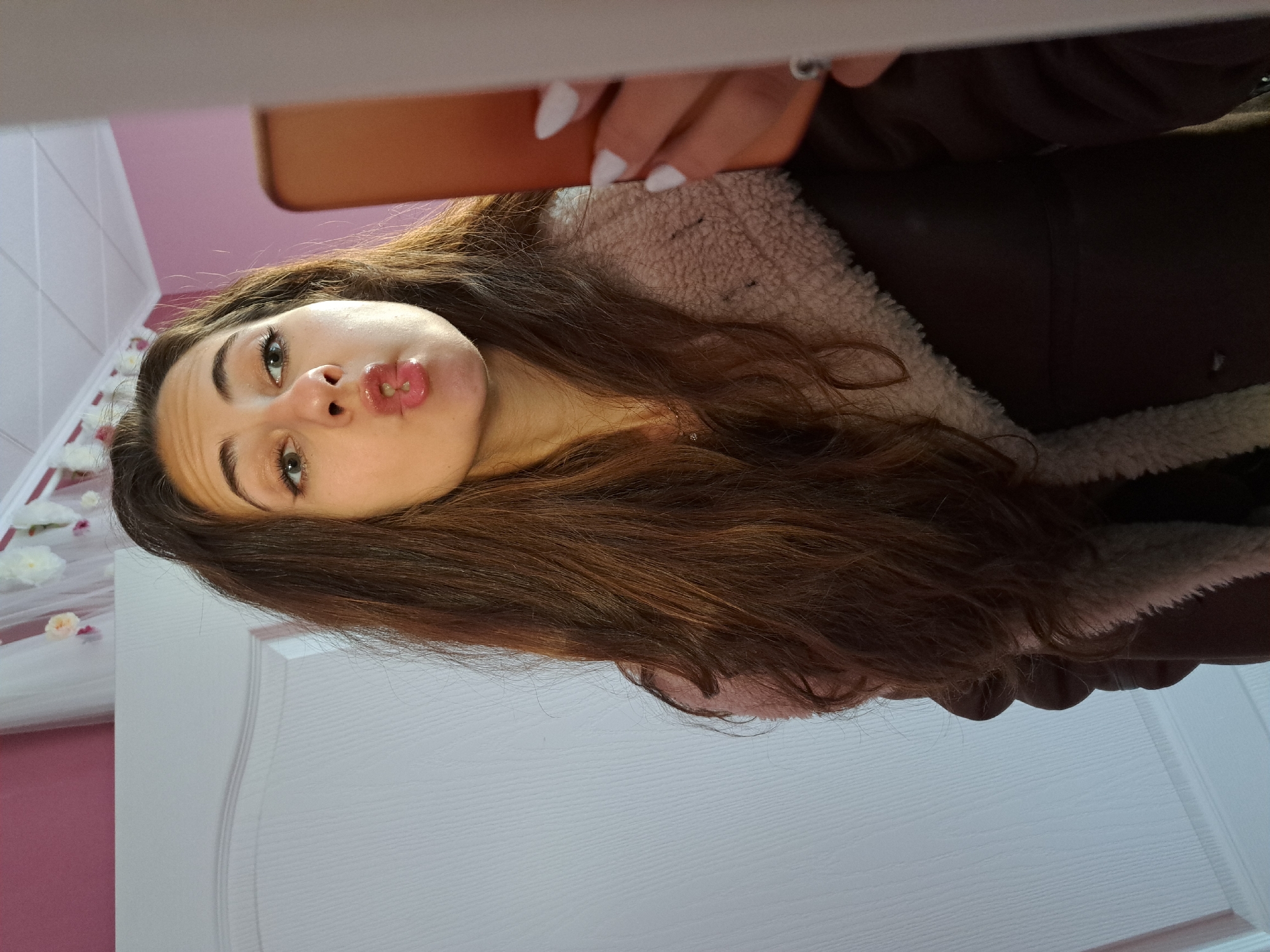 Woman takes selfies indoors in Chepintsi, Bulgaria
