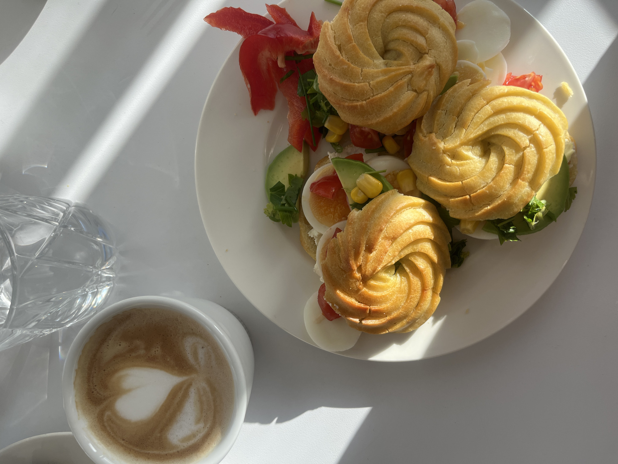 Breakfast meal with stuffed cream puffs photographed in Germany
