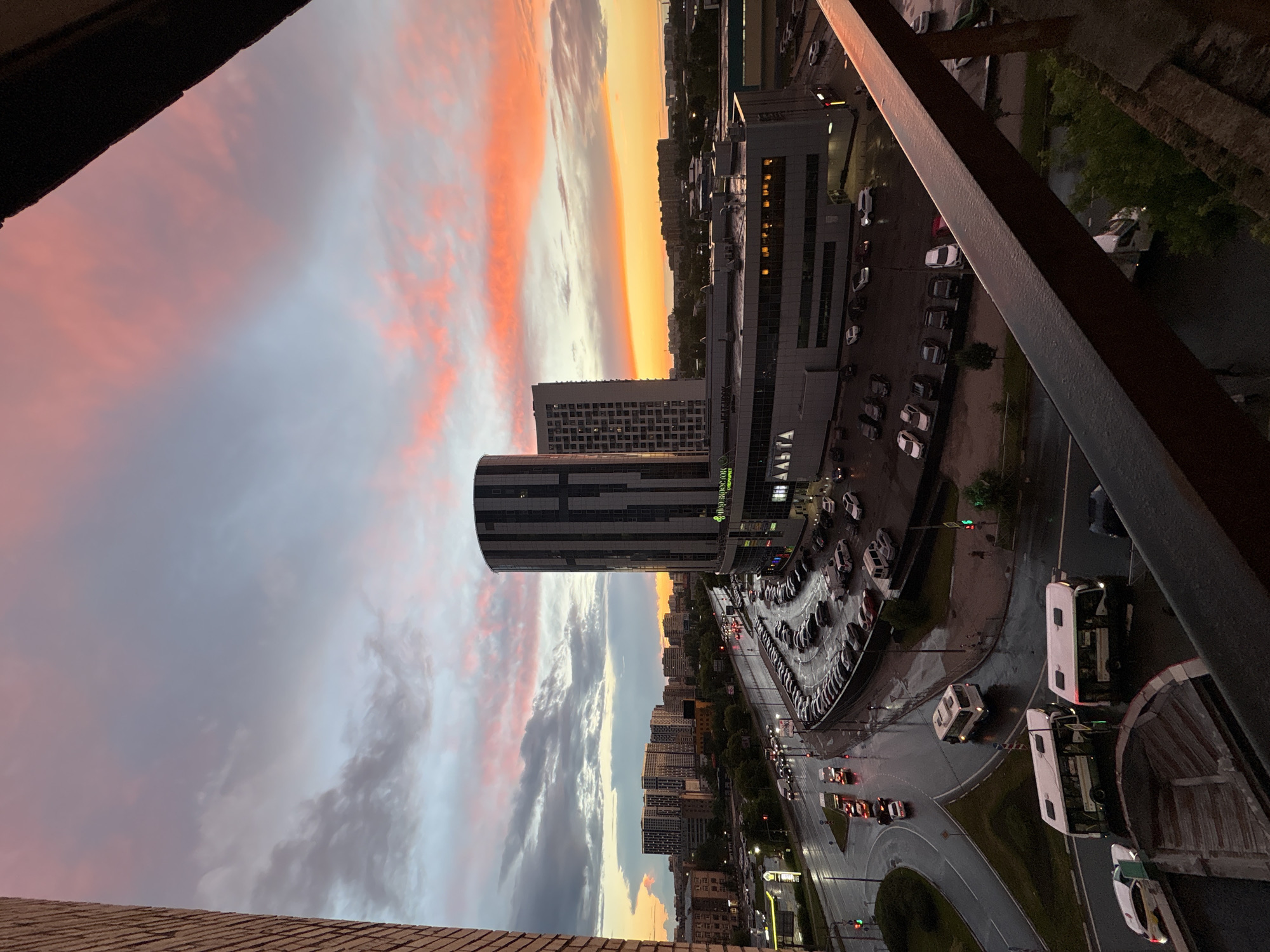 Sunset over Mytishchi with dogs, towers, and dramatic skies