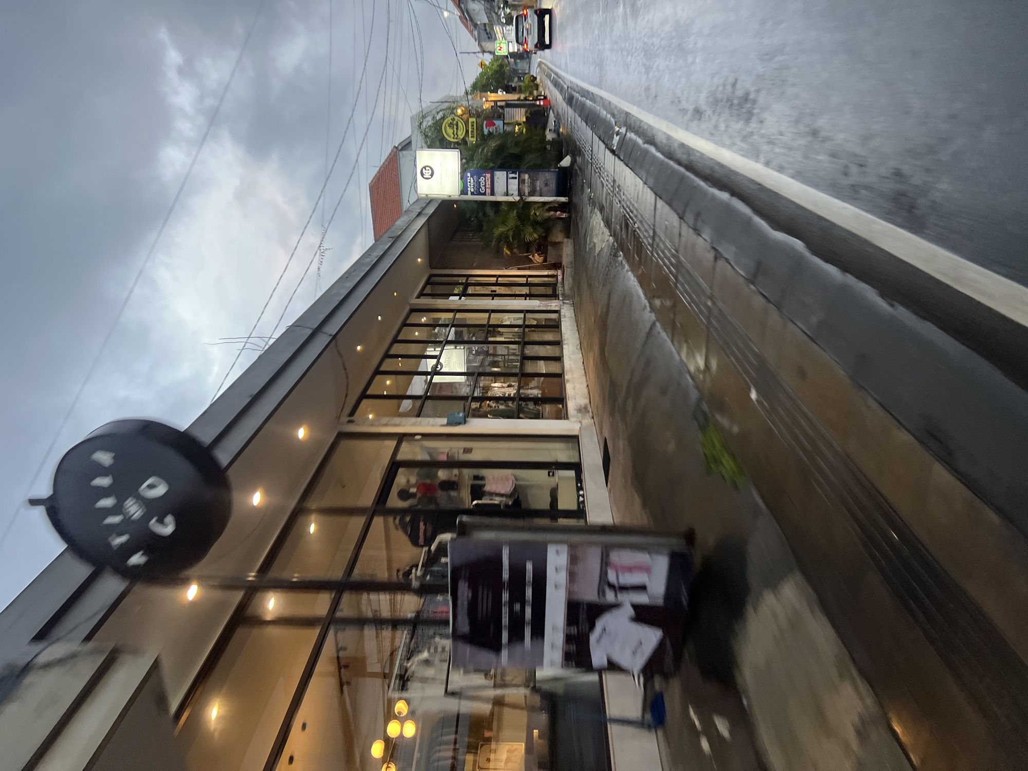 Evening scooter commuters navigate wet streets in North Kuta