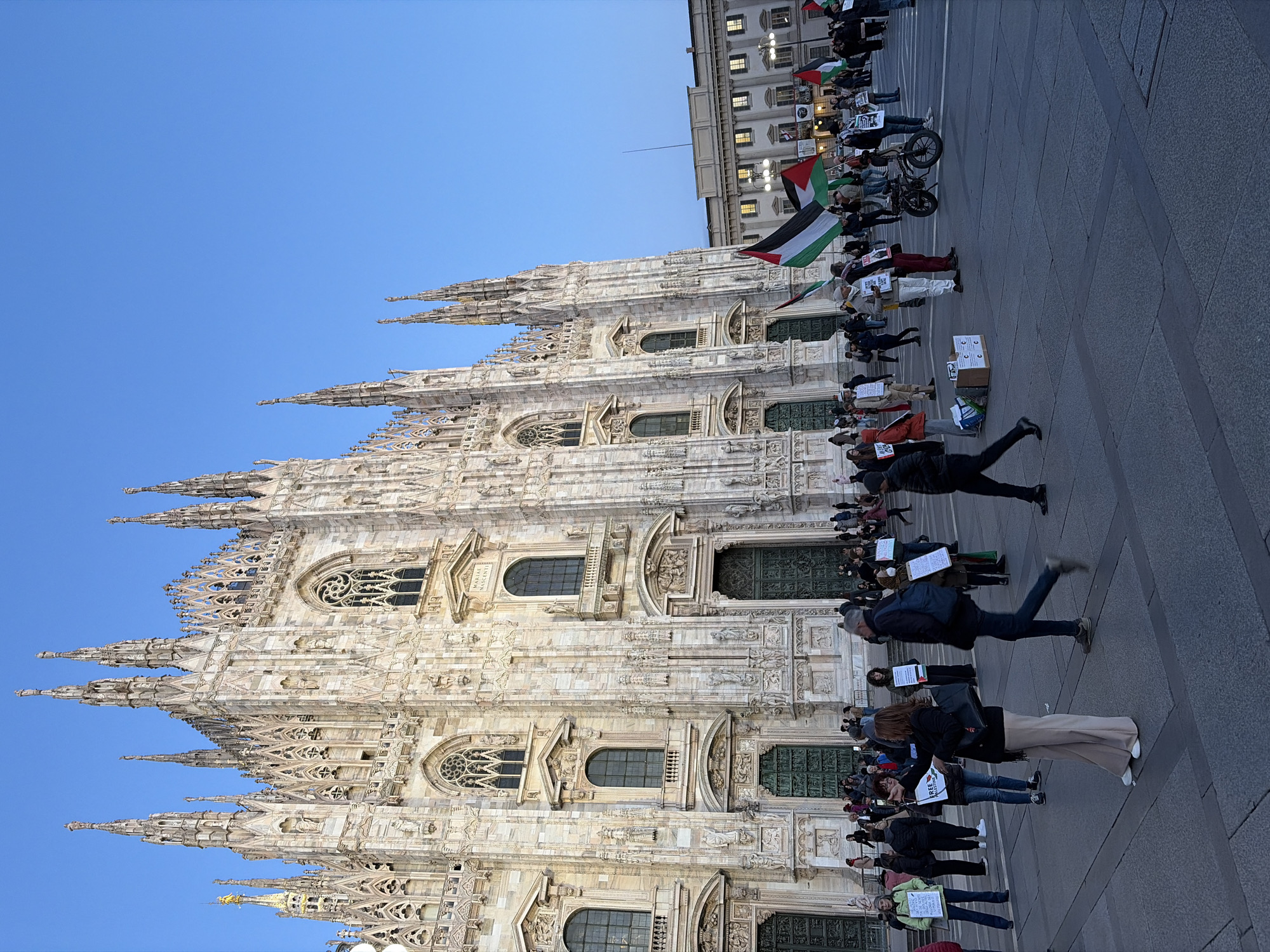 Evening crowds gather in Milan's historic Piazza del Duomo
