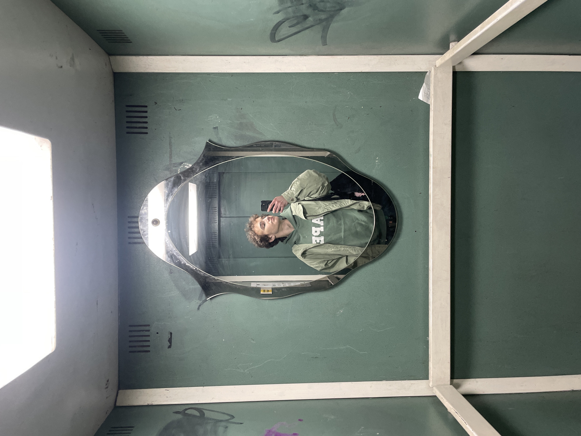 Person takes selfies in elevator in Krasnoyarsk, Russia