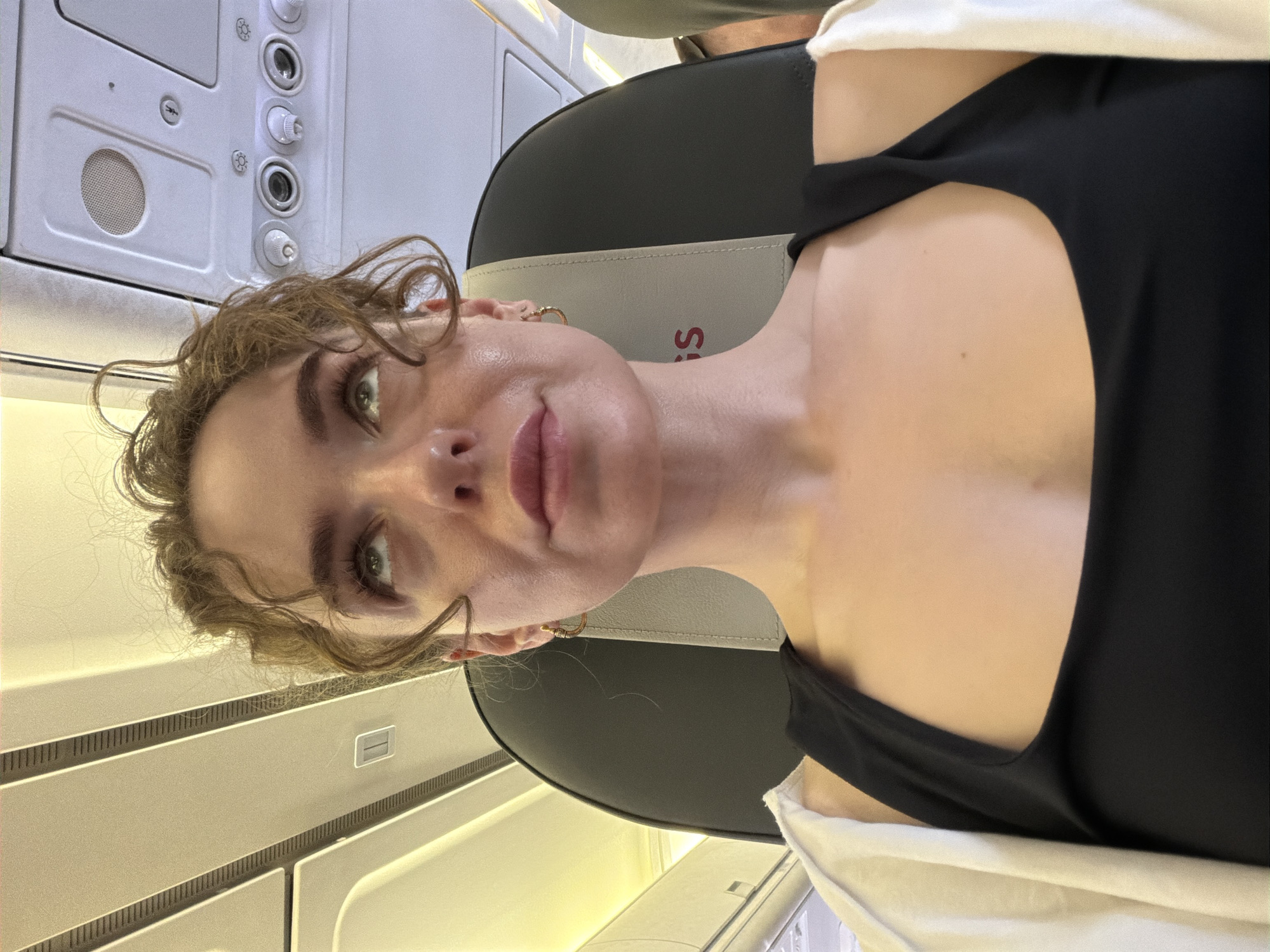 Woman seated in aircraft cabin in Zhukovsky, Russia