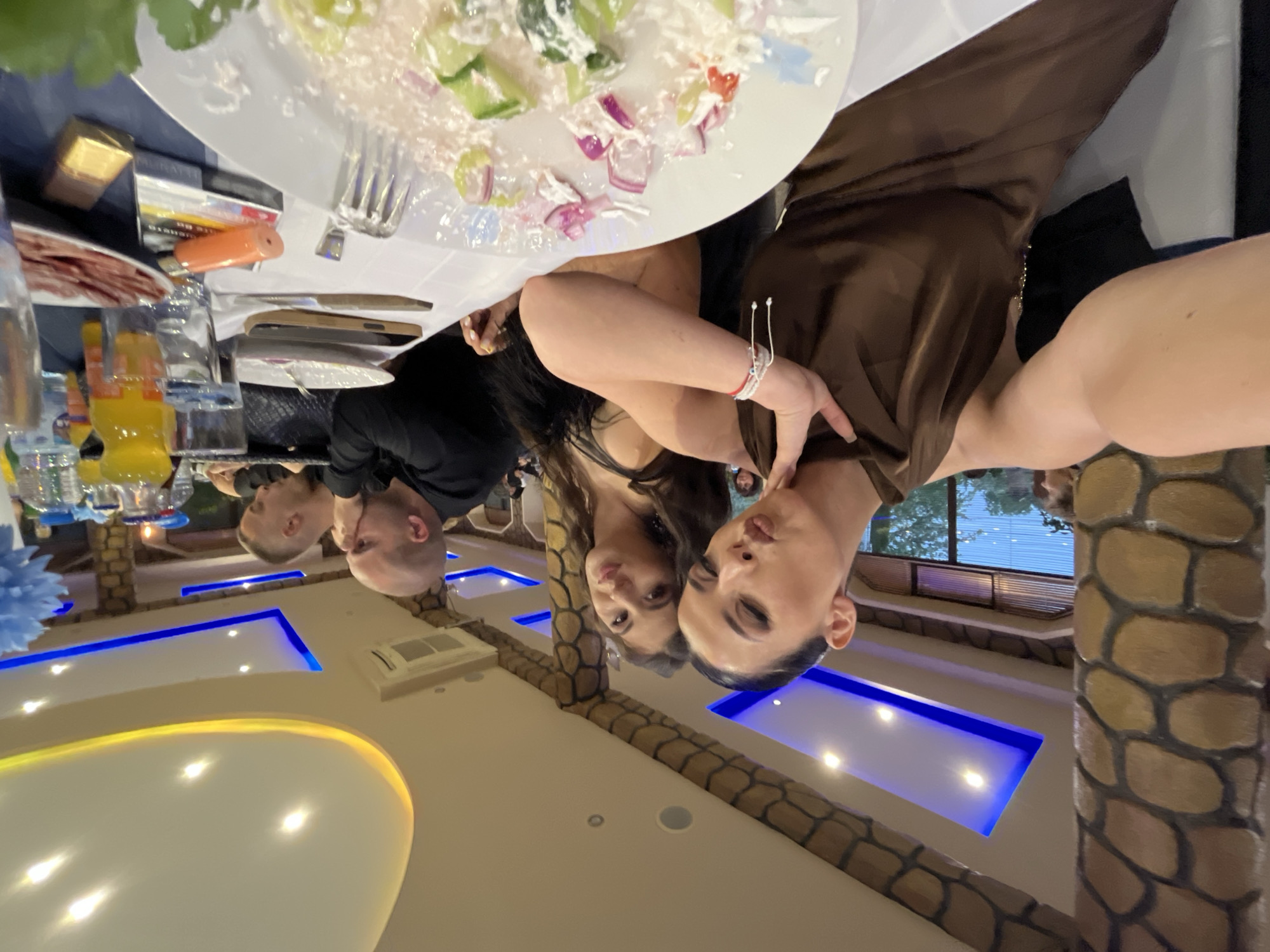 Two women take angled selfie at Bulgarian restaurant