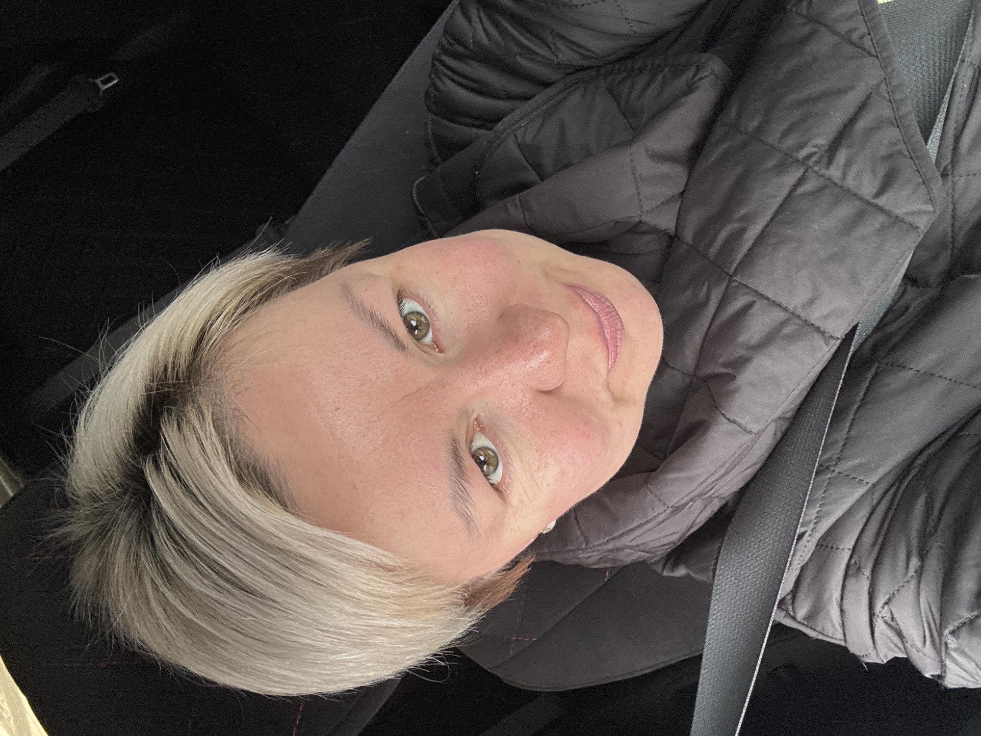 Woman observed in vehicle interior in rural Russia