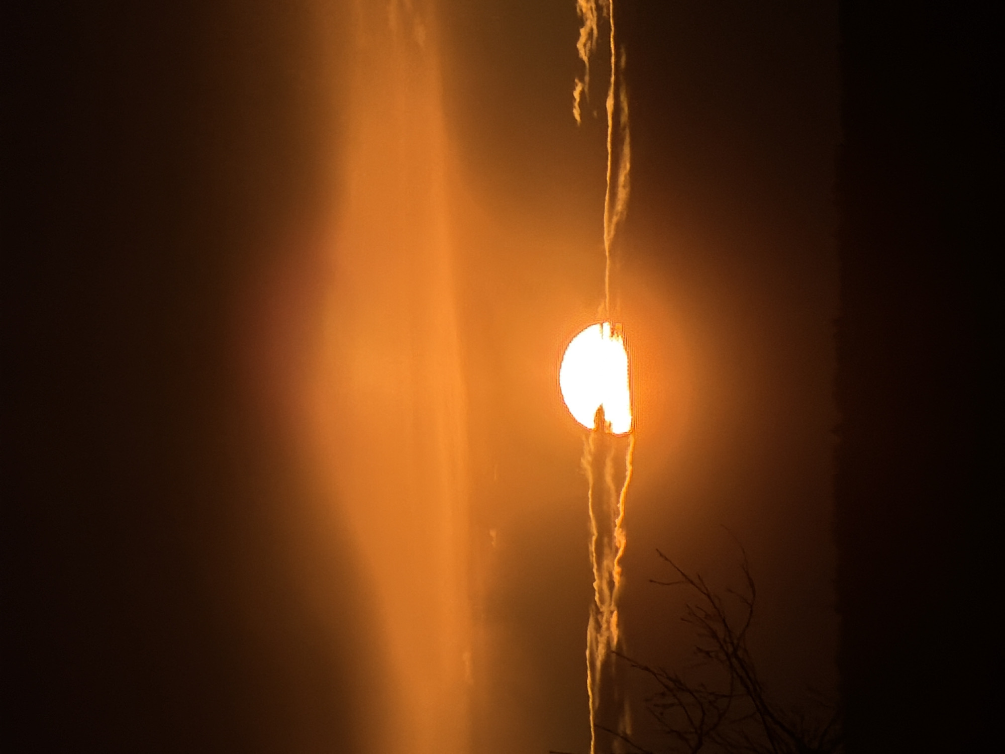 Dramatic sunset and visible moon captured in Chaikovsky, Russia