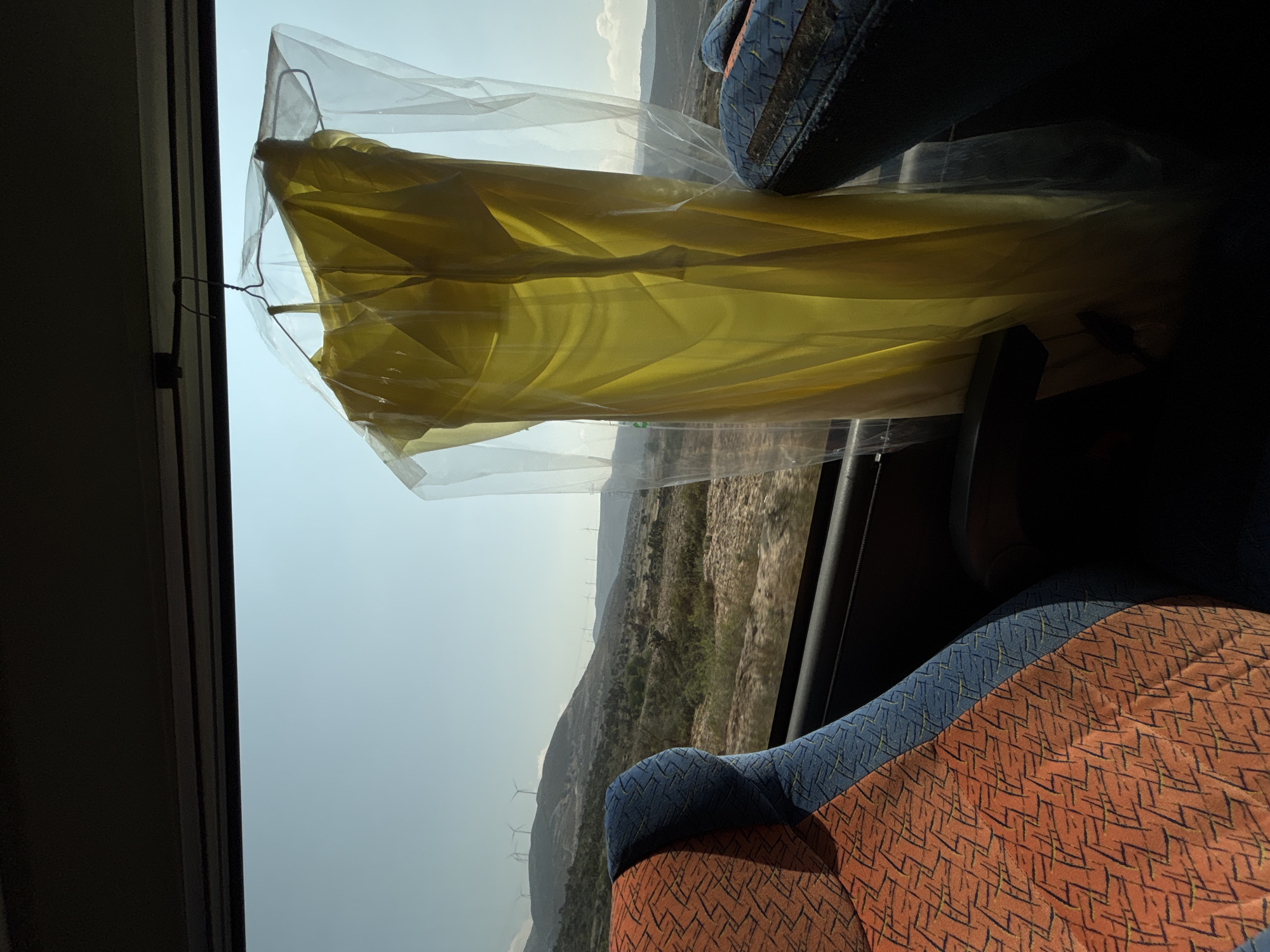 Bus passenger films desert wind turbines in Azumbilla
