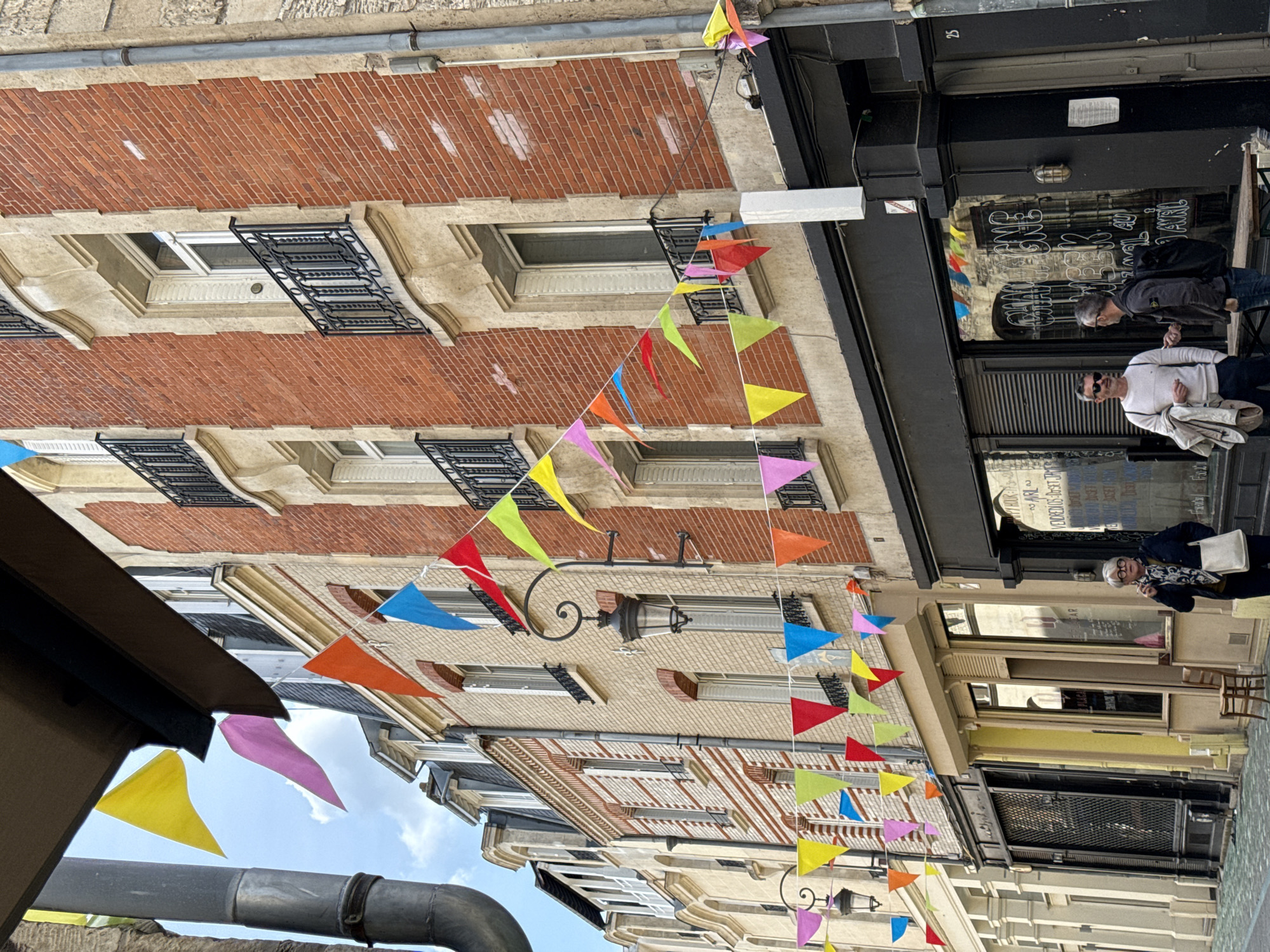 Festive bunting decorates street scene in Reims, France