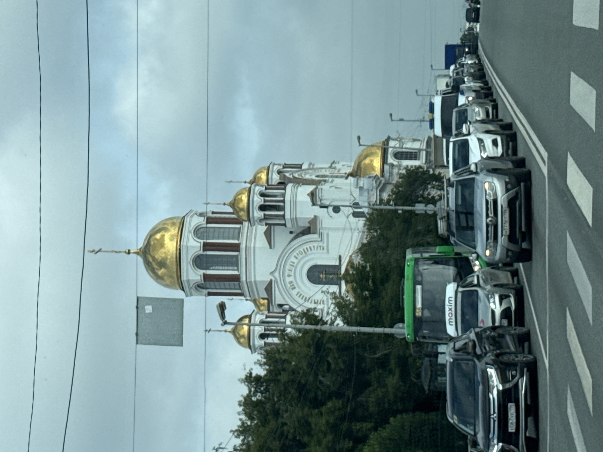 Traffic stop in Yekaterinburg with a golden-domed church in view