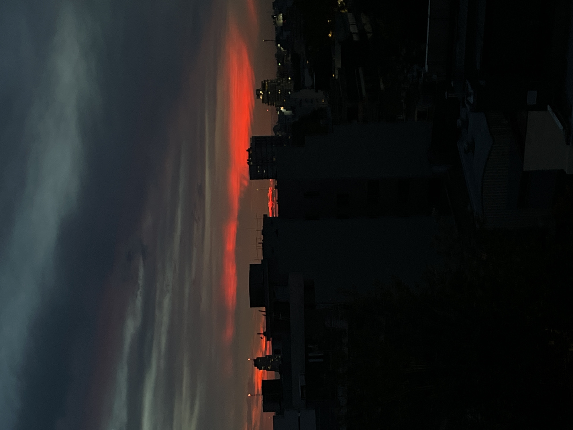 Sunset captured over Buenos Aires cityscape at dusk