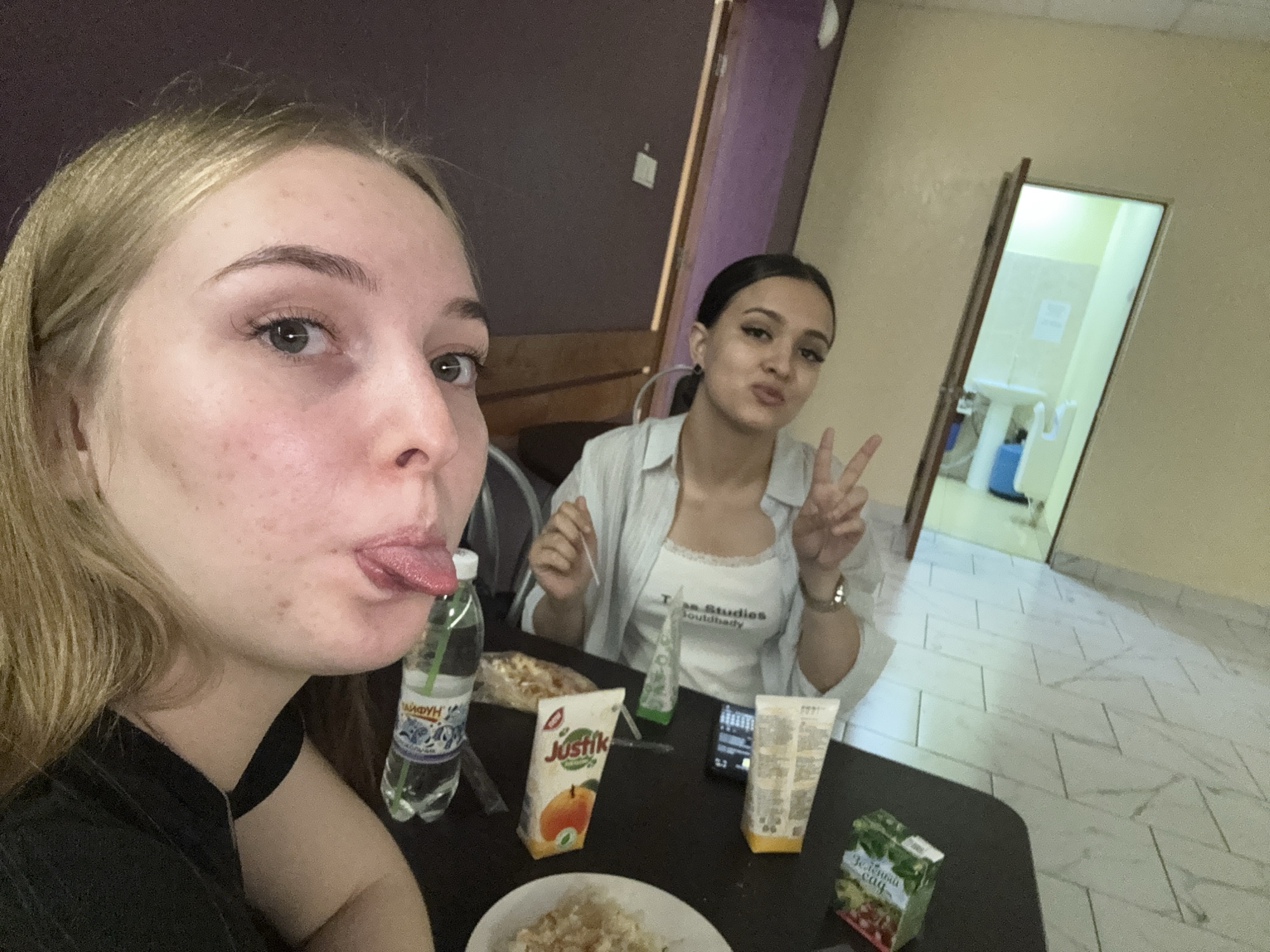 Two women share late night meal in Perm apartment