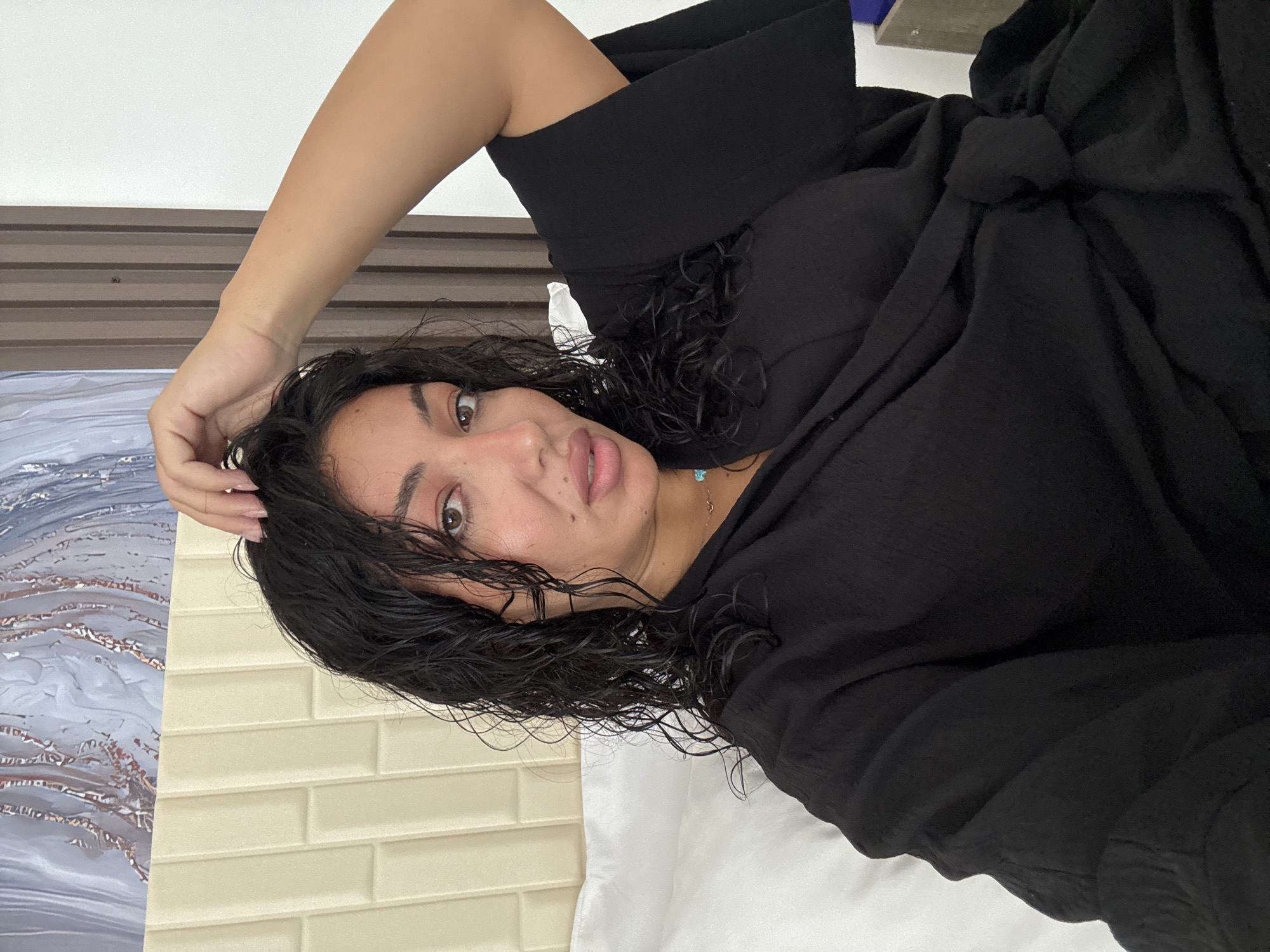 Woman photographed in bedroom during early morning session in Kuta