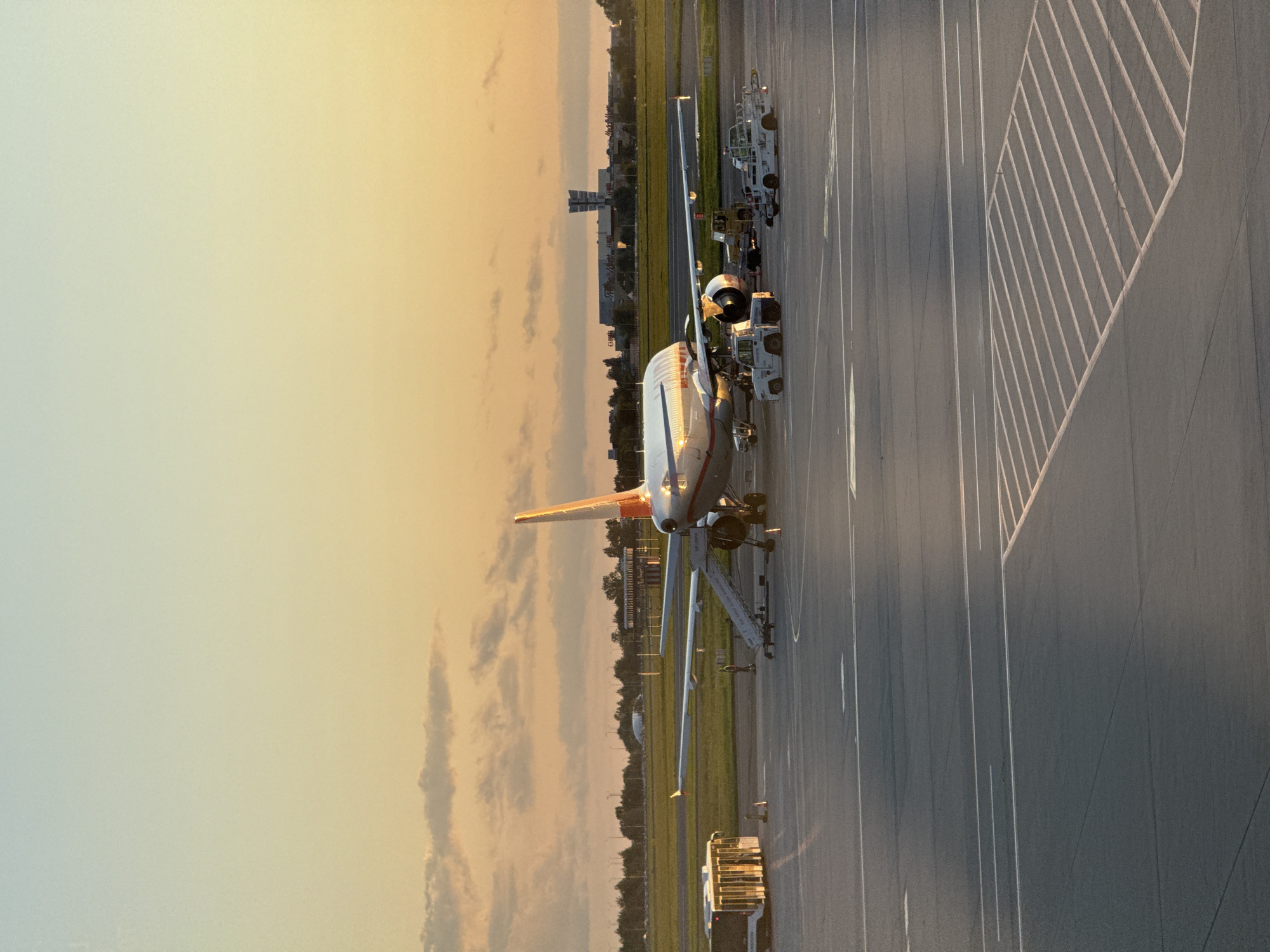 Orange and white A320 on the tarmac at Warsaw airport