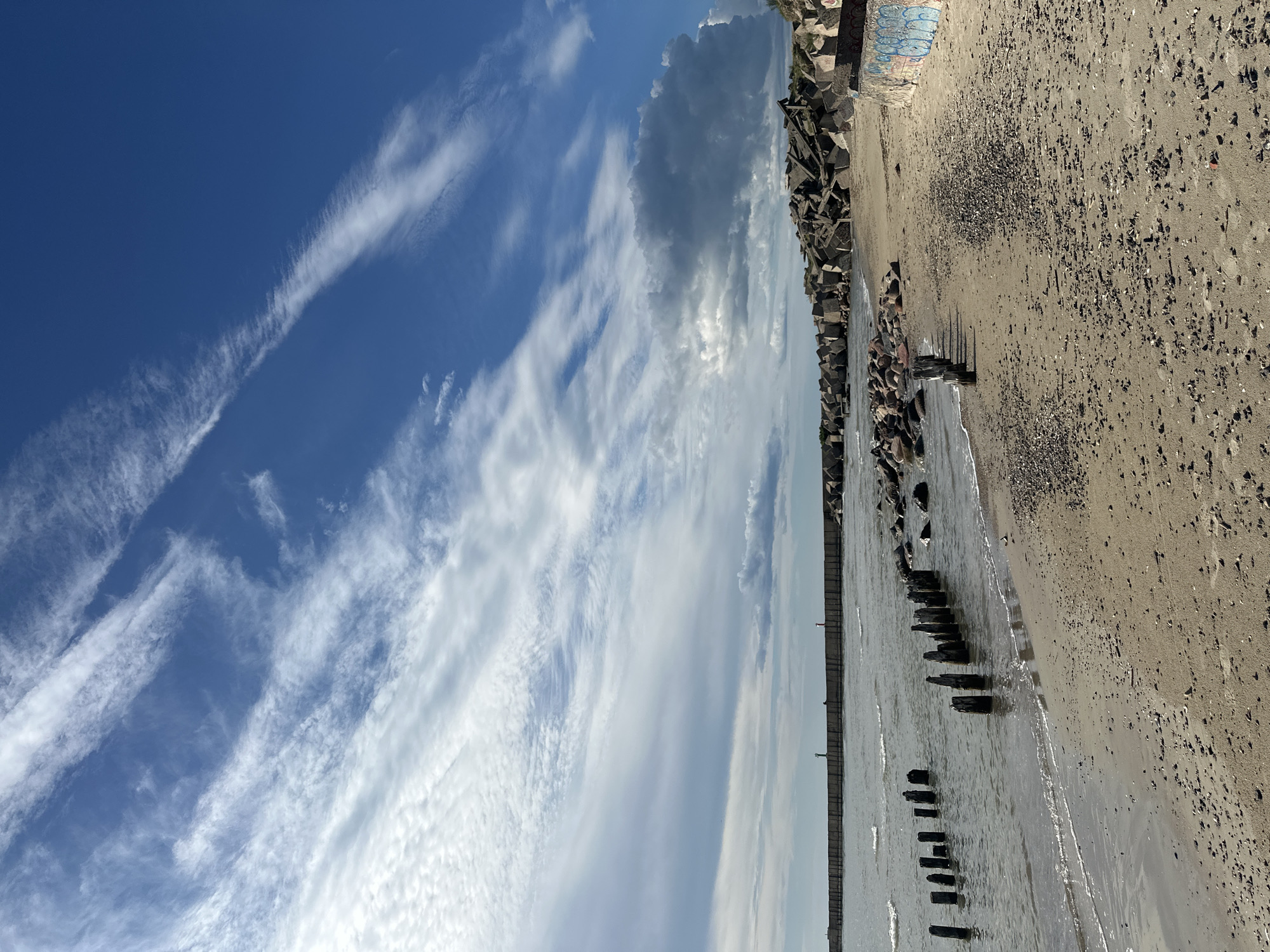 Liepāja's weathered Baltic coast — beach, barriers, and port edges