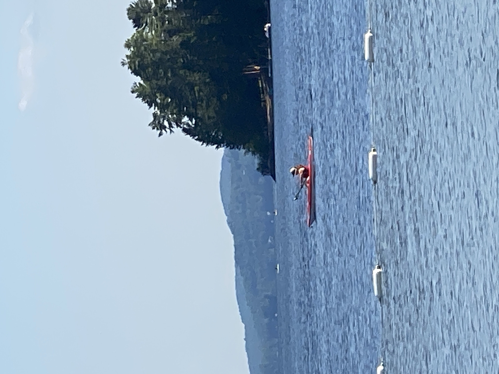Kayaking a clear, calm lake near Duhamel on a sunny afternoon