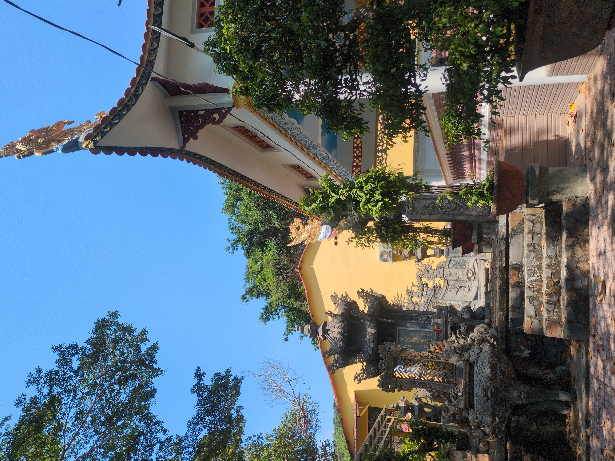 Religious statues observed in Phú Quốc courtyard overlooking ocean
