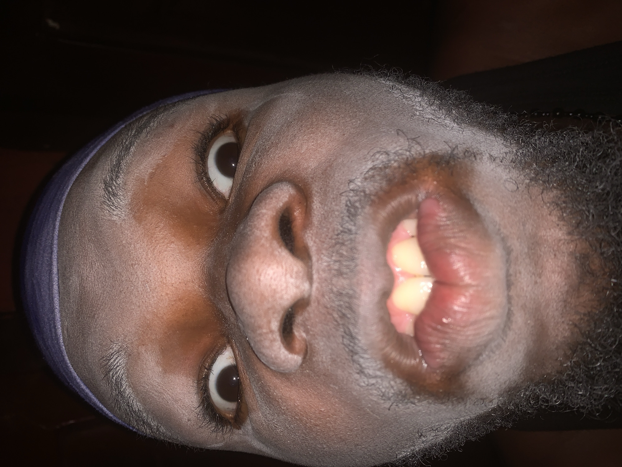 Man photographed in dimly lit setting in Onitsha