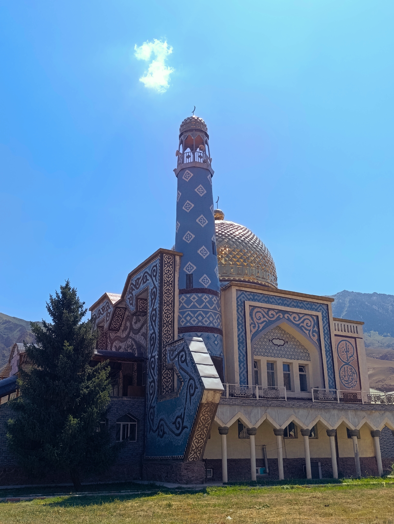 Inside and outside a decorated mosque in Naryn City