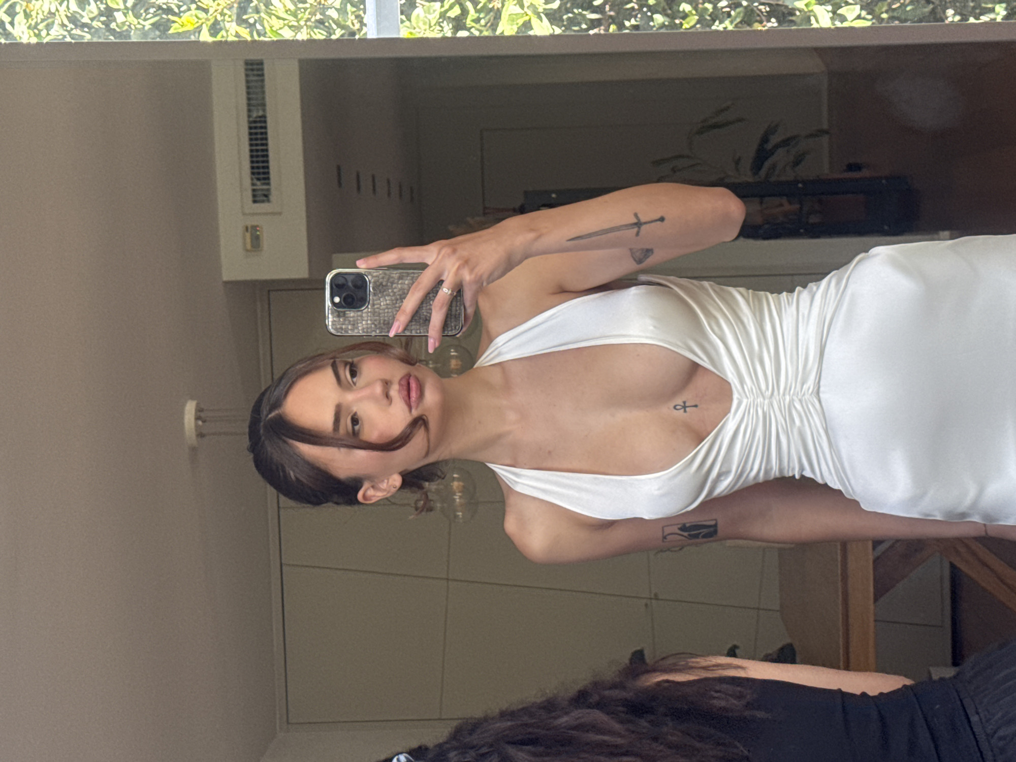 Woman takes mirror selfie indoors in Tel-Aviv