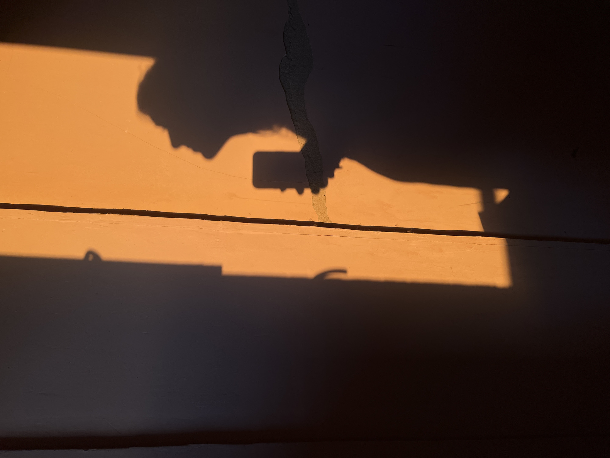 Sunset and shadows through Kyiv's unfinished walls