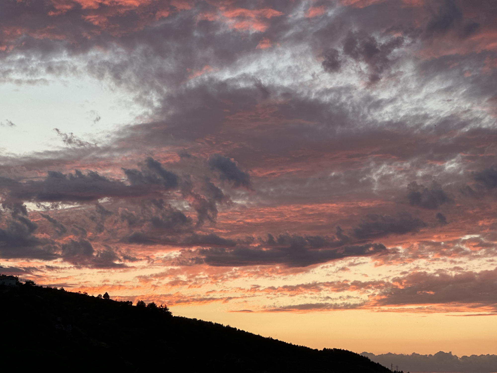 Colorful sunset lights up the sky over Asenovgrad, Bulgaria