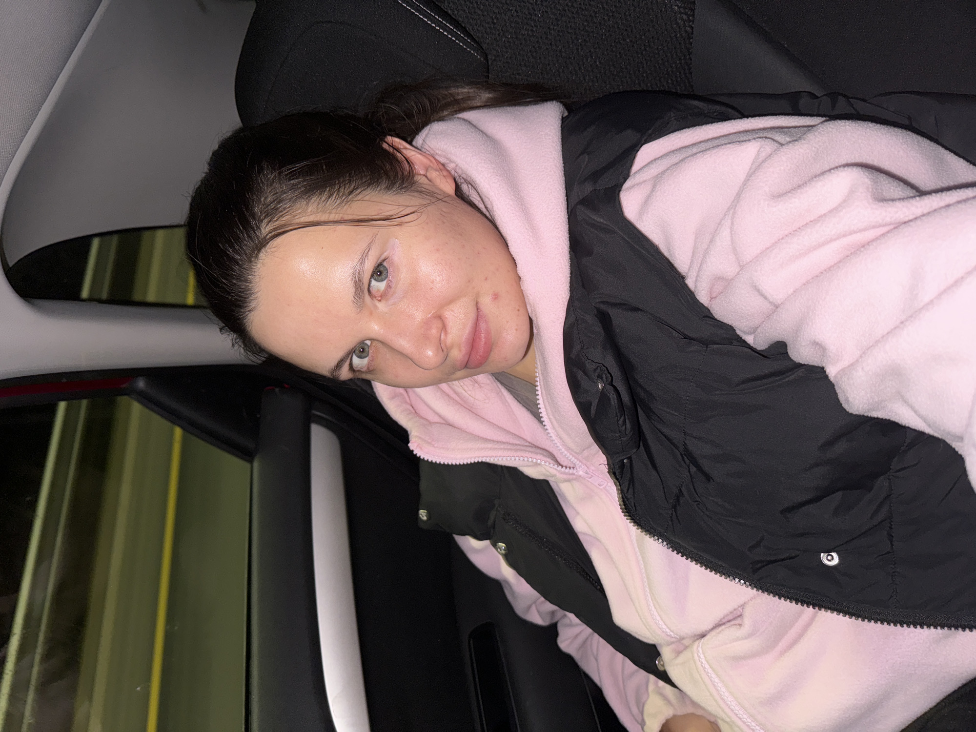 Woman in pink hoodie observed in car in Spirino