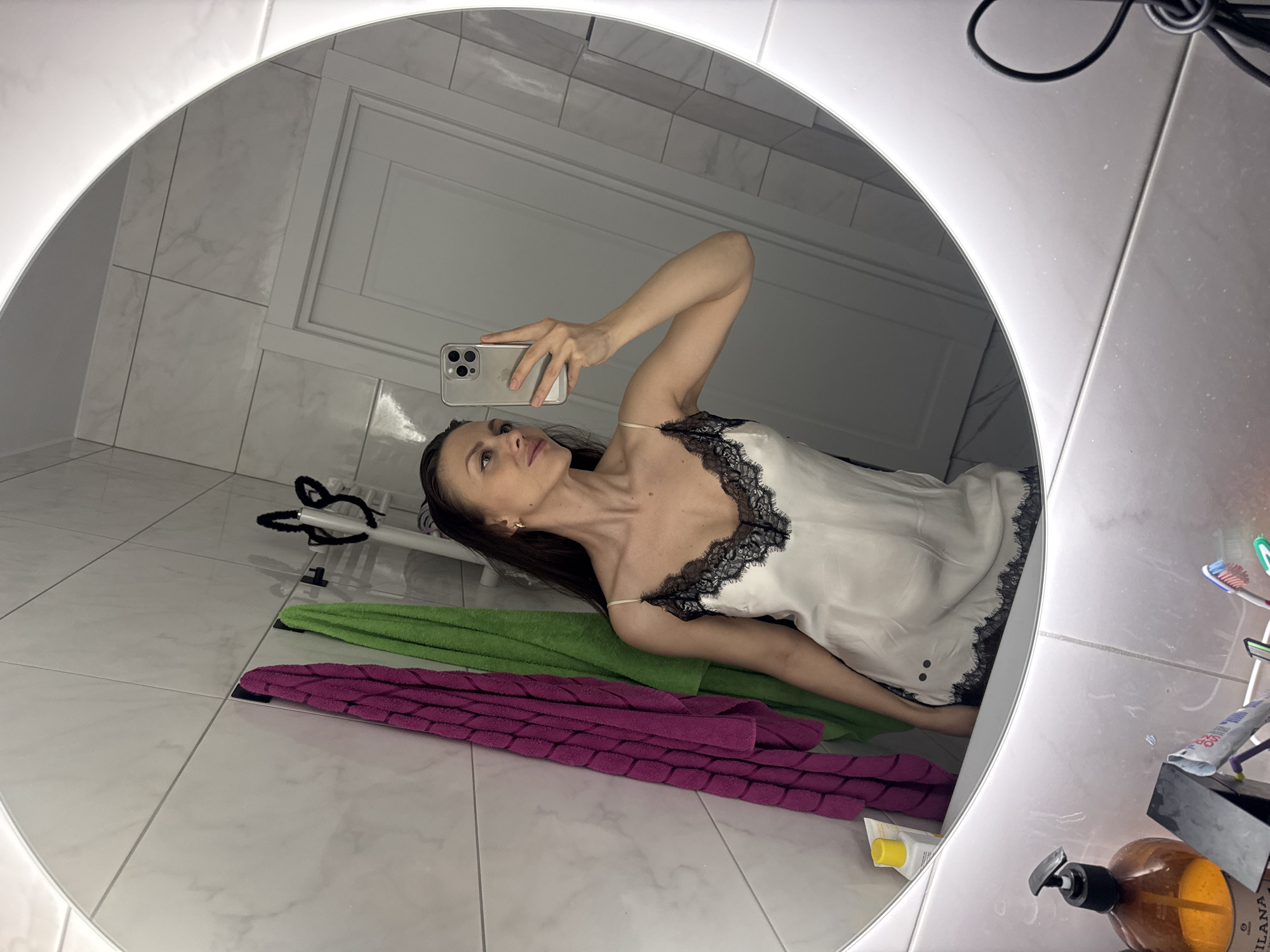 Woman takes bathroom selfies in Murino, Russia