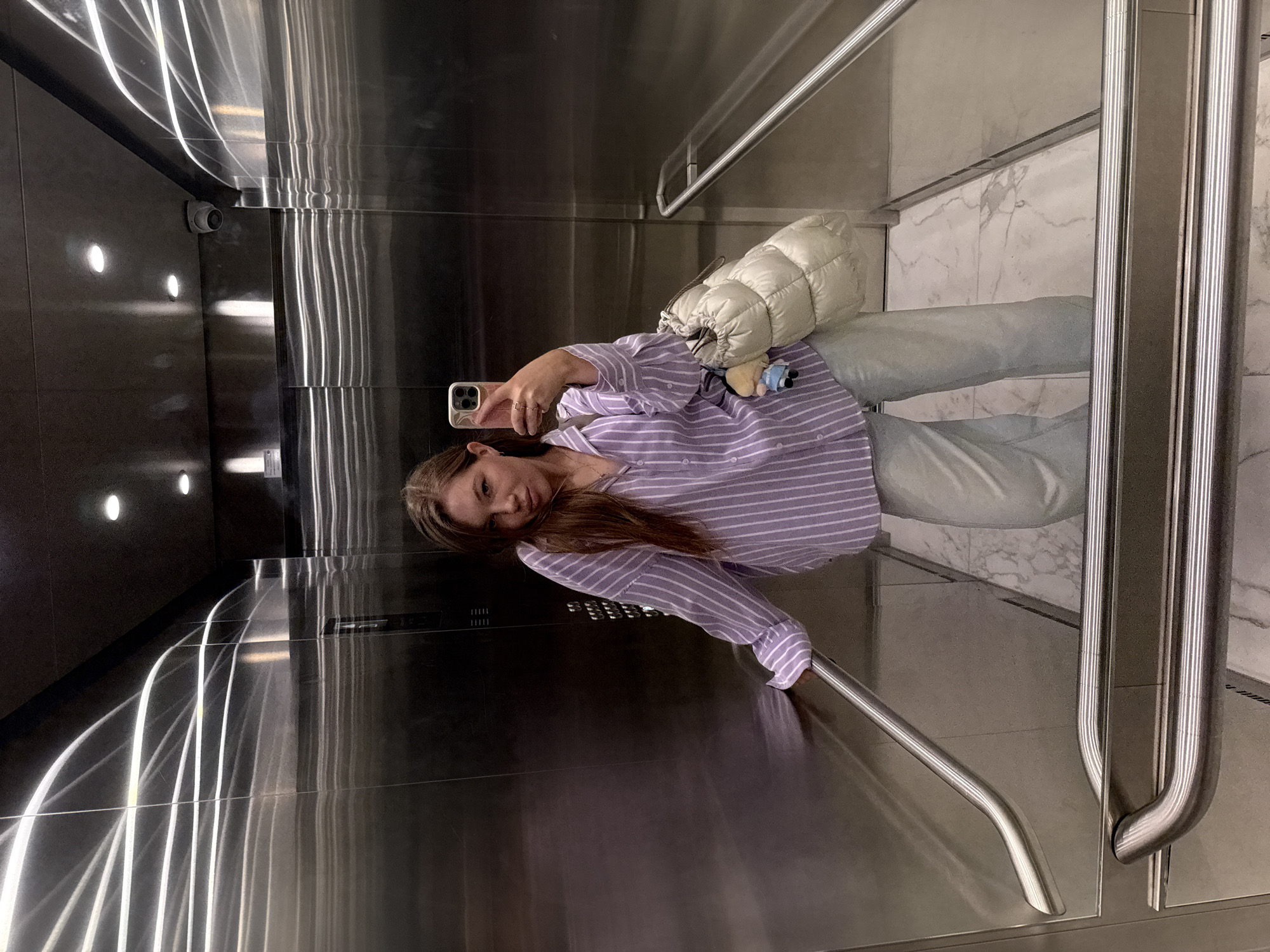 Woman takes elevator selfie in Belgrade