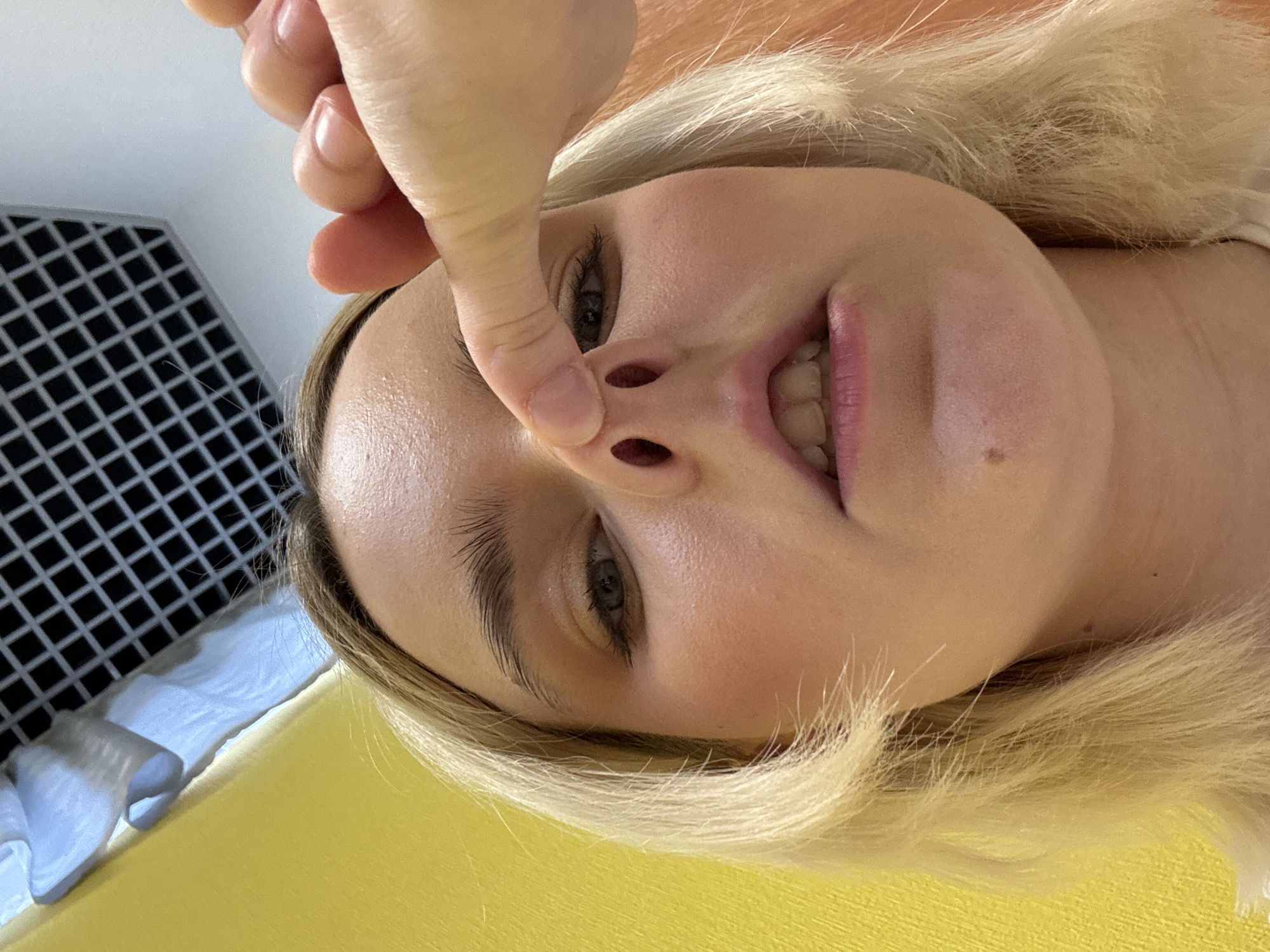 Woman enjoys casual meal, takes playful photos in Saint Petersburg