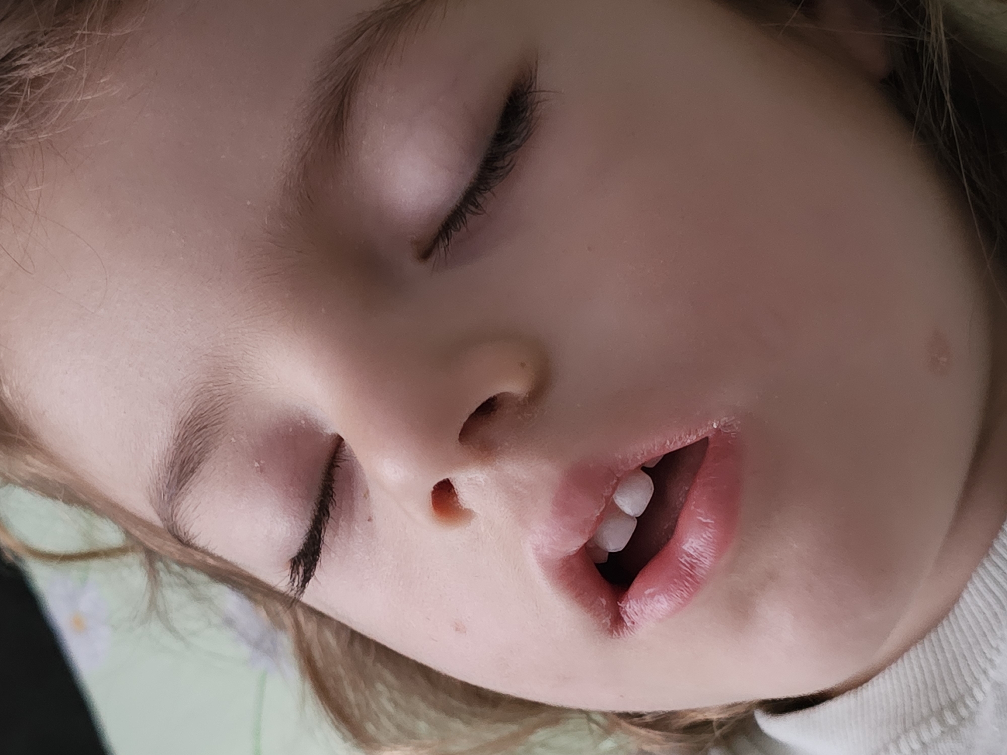 Sleeping child photographed in quiet morning moment in Khimki