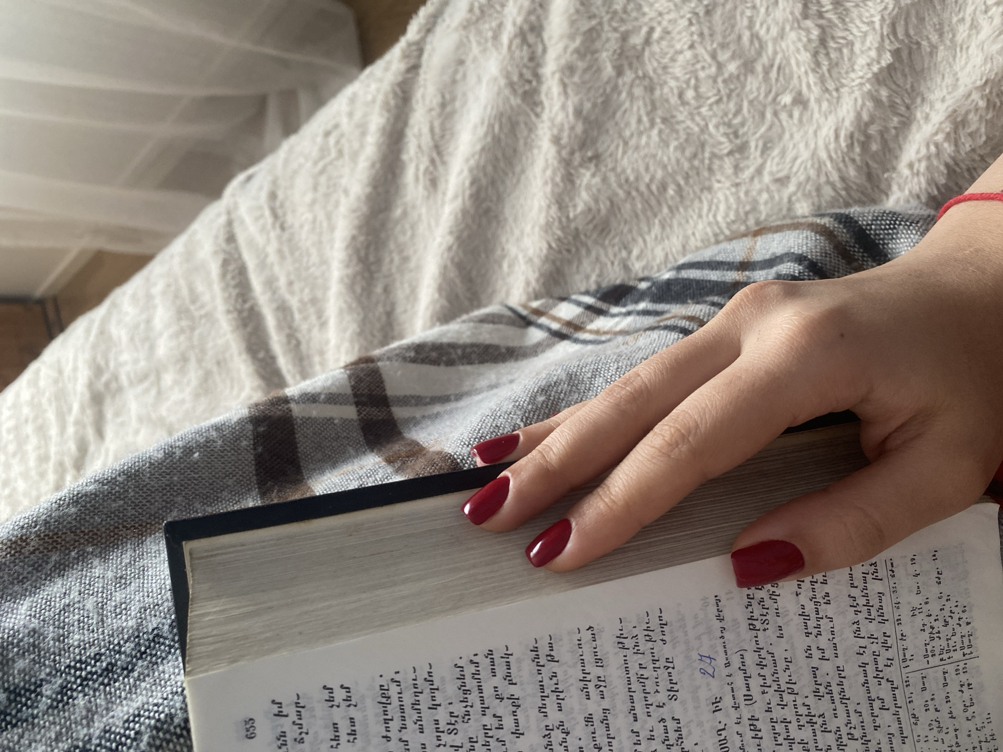 Quiet reading moment with Armenian book and tea in Sweden