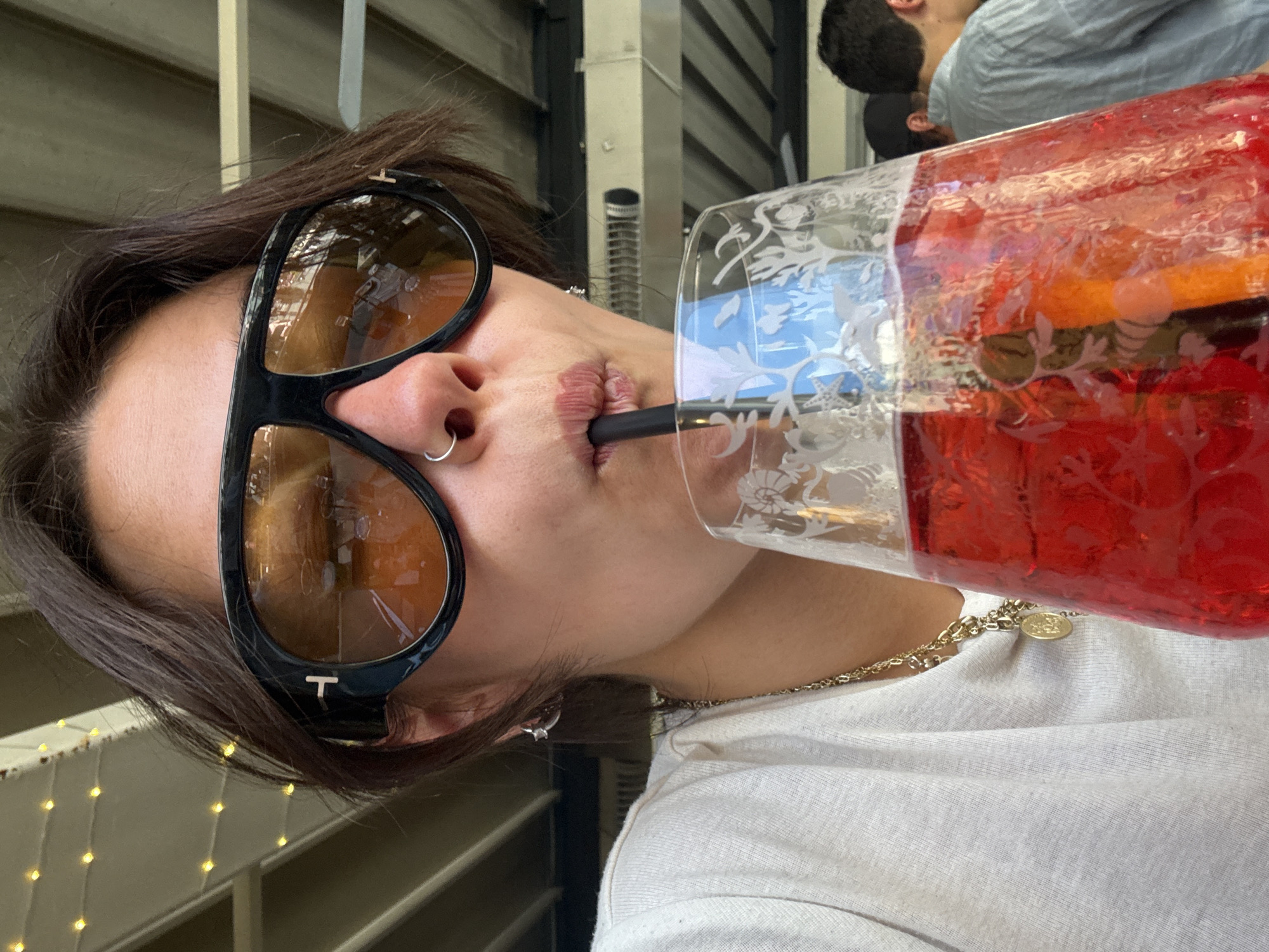 Tourist enjoys drinks at Florence cafe during afternoon break