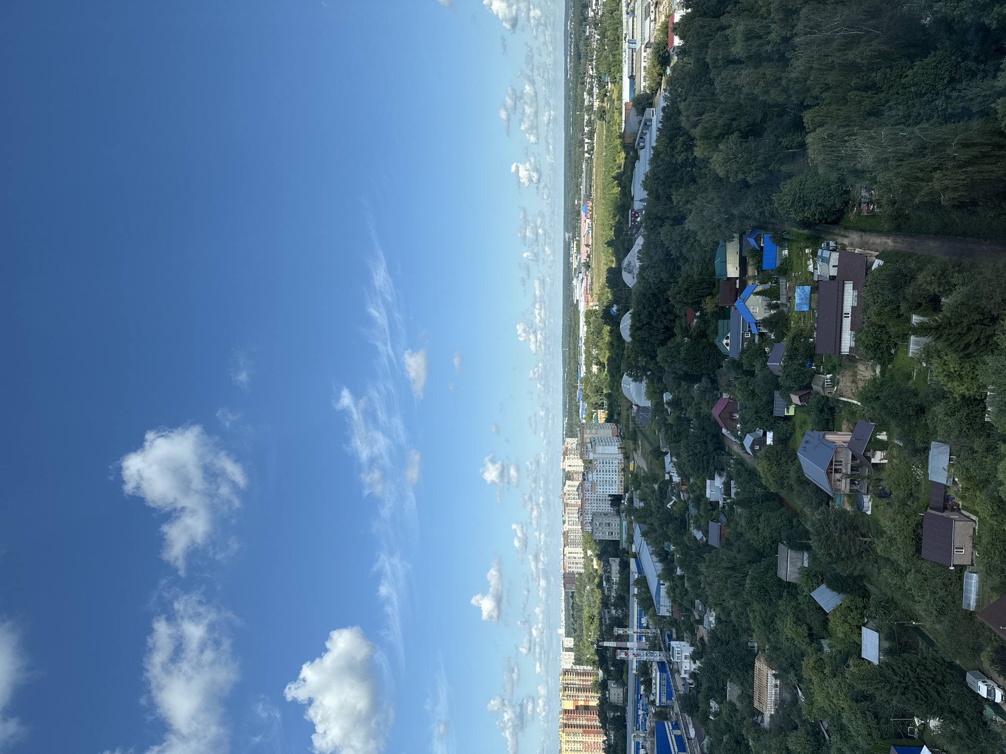 Aerial views over Moscow's wooded suburban fringe, August morning