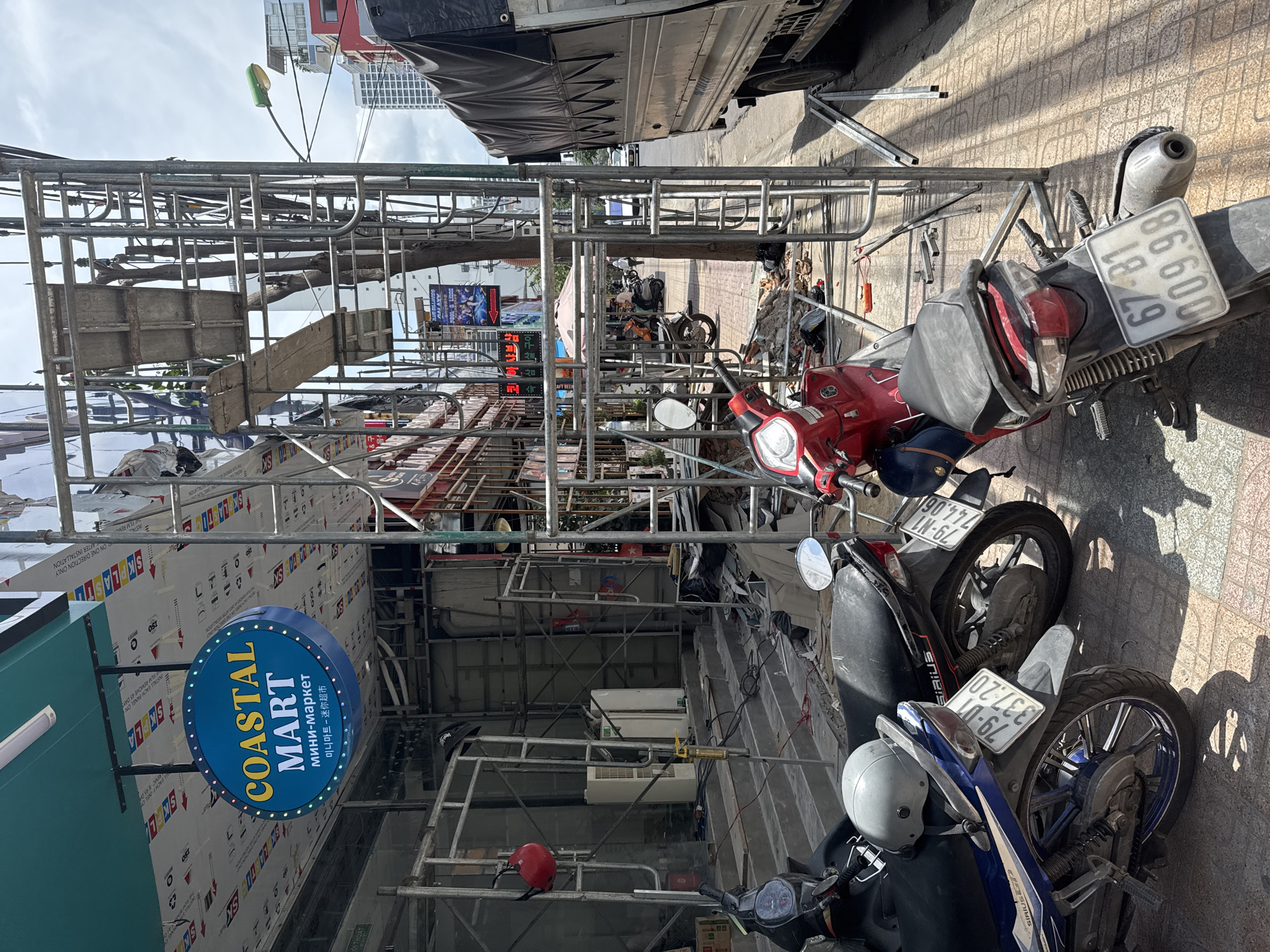 Street life, food, and construction in morning Nha Trang