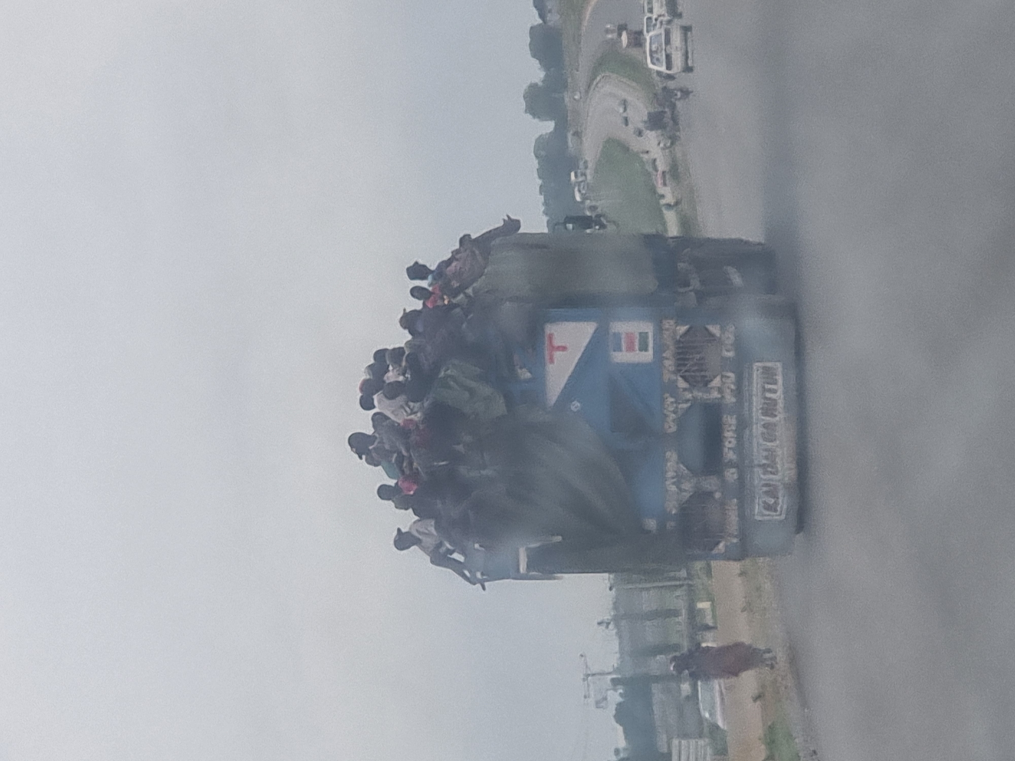 Loaded passenger truck travels through Pasere, Nigeria