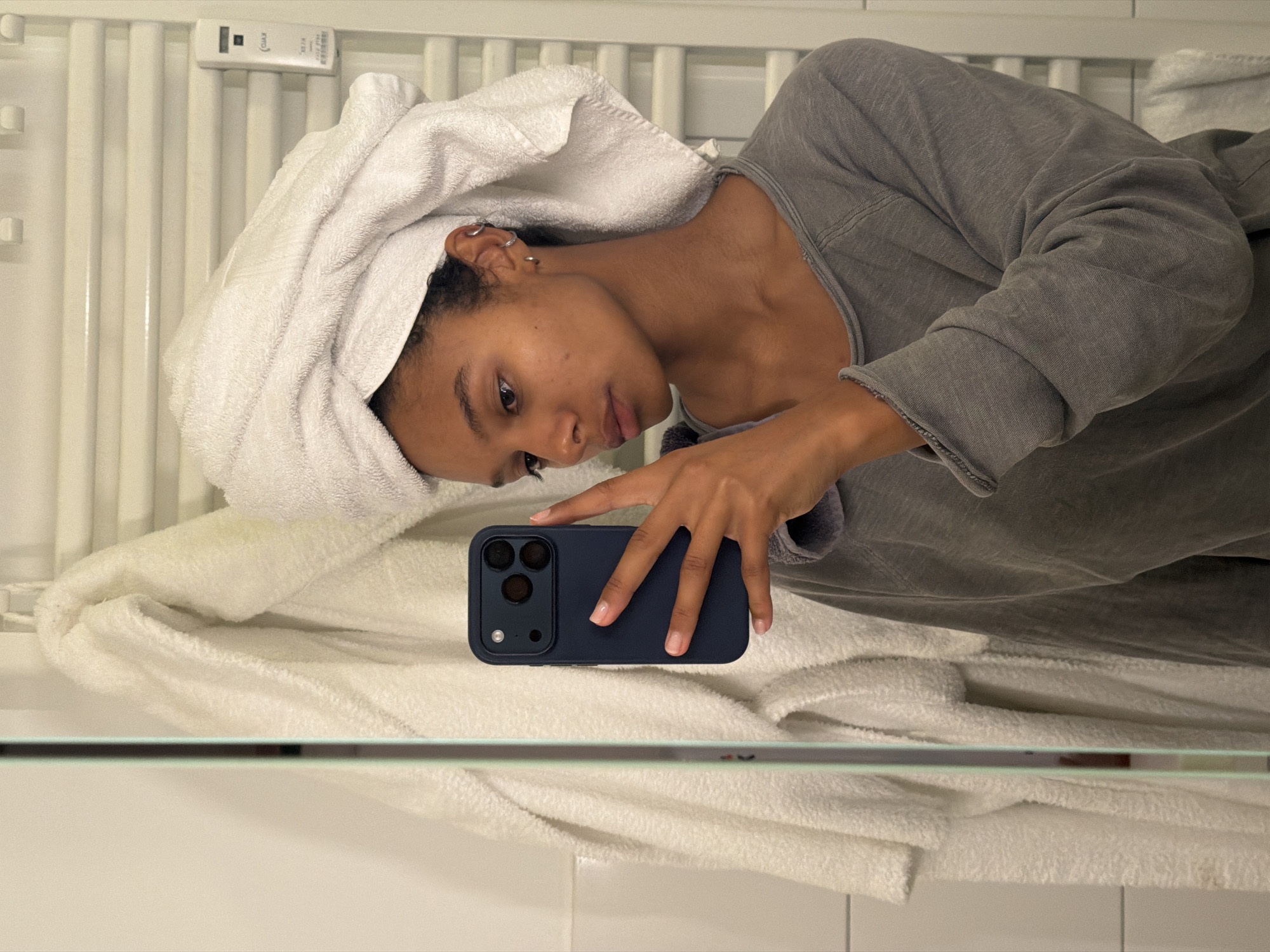 Post-shower selfie session in a Hamburg bathroom